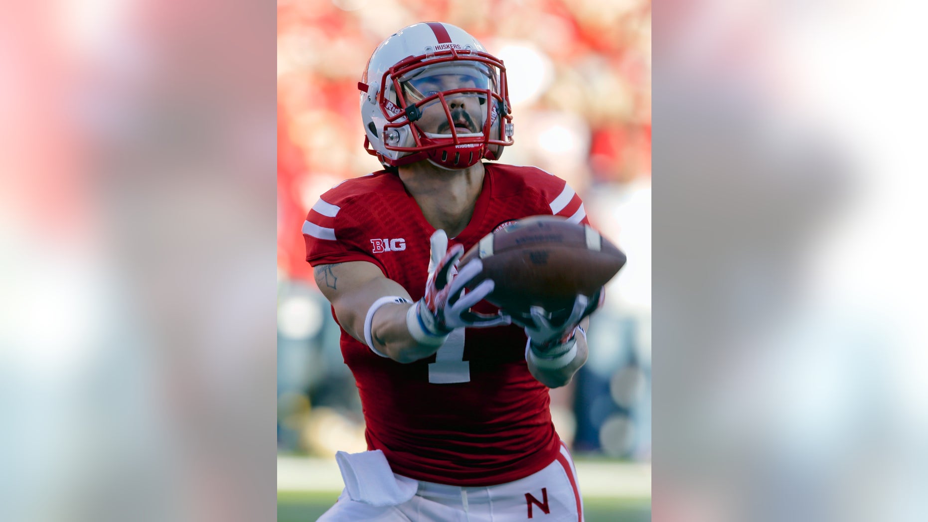 Nebraska wide receiver Jordan Westerkamp (1) fumbles a kickoff ball for a turnover in the first half of an NCAA college football game against Michigan State in Lincoln, Neb., Saturday, Nov. 16, 2013. (AP Photo/Nati Harnik)