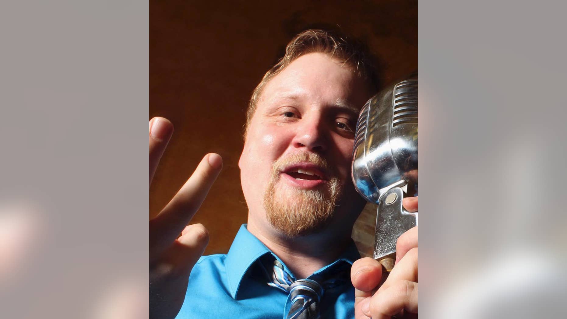 This May 17, 2013 photo provided by James E. Moriarty shows Adam Henze performing in Indianapolis, Henze, an Indiana University student who is a poet and a performer, has been named the Indianapolis 500's first official poet since the early 20th century. The competition revives an Indy 500 tradition from the 1920s, when an official poem was included in the race day program. (James E. Moriarty via AP)