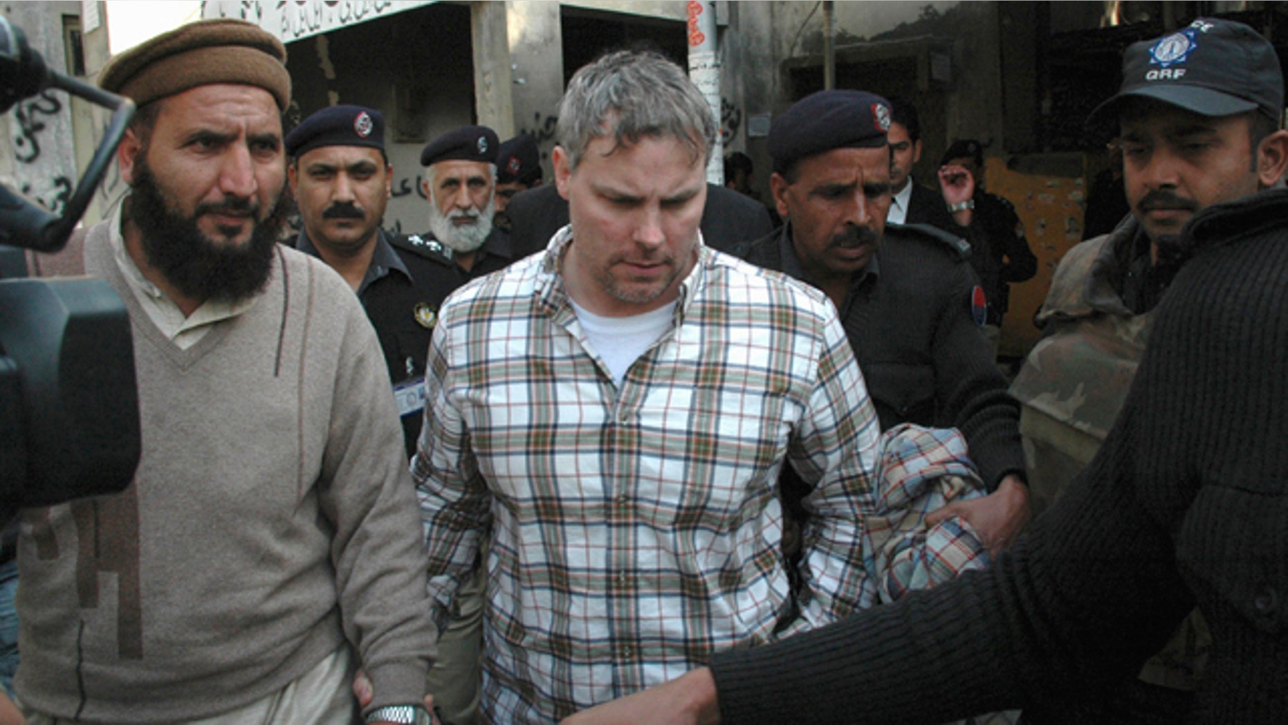 Jan. 28: Pakistani security officials escort a U.S. consulate employee, identified as Raymond Davis, to a local court in Lahore, Pakistan. Colorado authorities say Davis, accused of shooting and killing two men while working as CIA contractor in Pakistan, faces misdemeanor charges after a fight Saturday, Oct. 1, 2011, over a shopping center parking spot in Highlands Ranch, Colo.