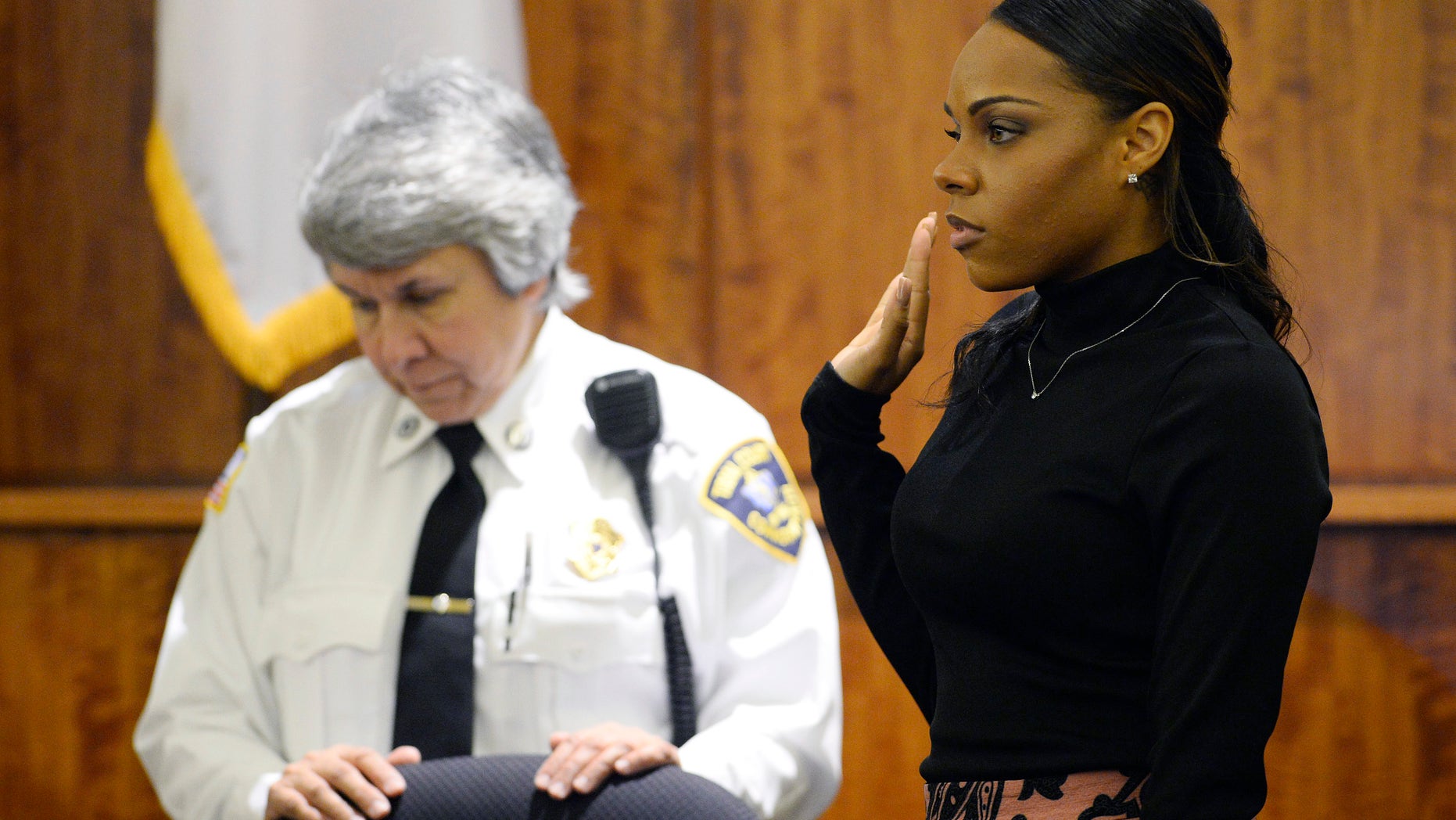 Shayanna Jenkins sworn in during Aaron Hernandez's murder trial, Friday, March 27, 2015, in Fall River, Mass.