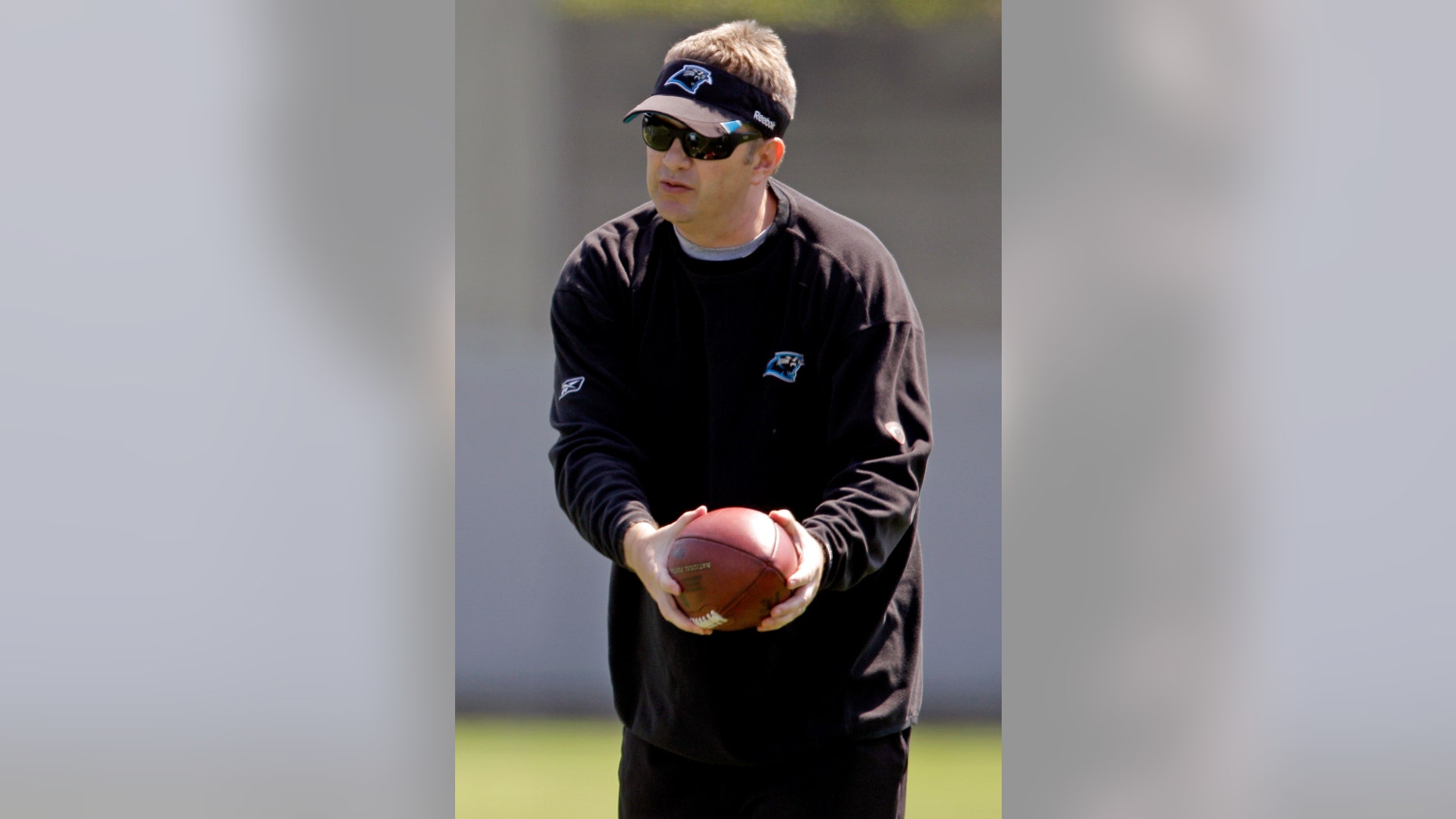 FILE - In this June 7, 2012, file photo, Carolina Panthers offensive coordinator Rob Chudzinski instructs players during an NFL football practice in Charlotte, N.C. A person familiar with the decision said Thursday, Jan. 10, 2013, that the Cleveland Browns have hired Chudzinski as their new coach. (AP Photo/Chuck Burton, File)