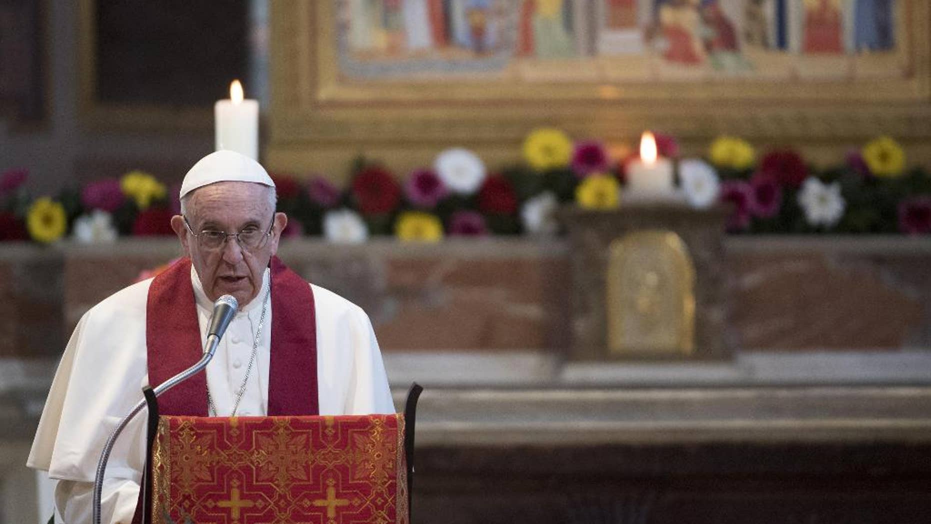 Pope Francis speaks in the Basilica of St. Bartholomew in Rome, Saturday, April 22, 2017, as he celebrates the Liturgy of the Word in memory of the martyrs of the 20th and 21st centuries. (Maurizio Brambatti/Pool photo via AP)