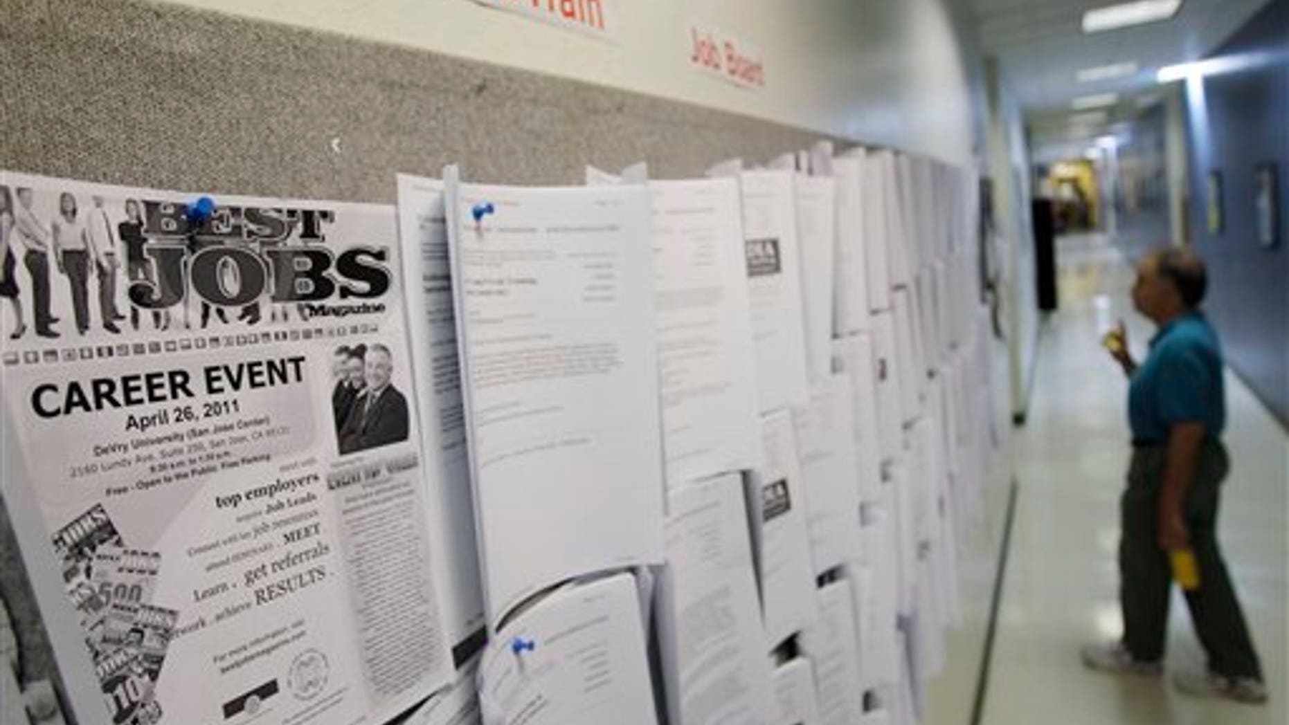 April 1: An unemployed man looks at job listings in Menlo Park, Calif.