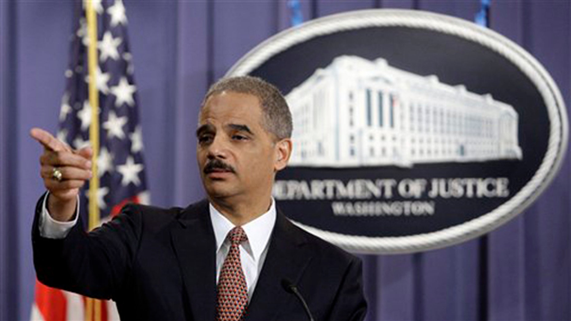 FILE: Attorney General Eric Holder gestures during a news conference at the Justice Department in Washington, D.C., on Nov. 13, 2009. (AP Photo)