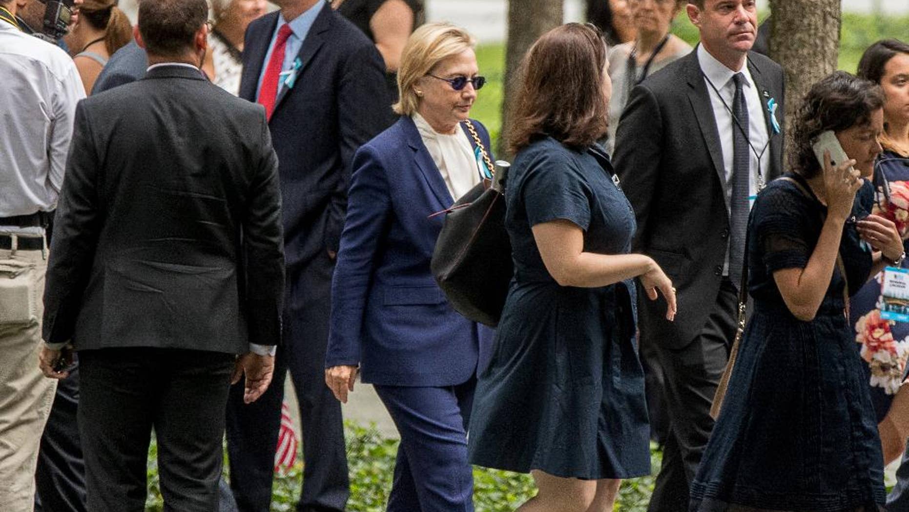 Democratic presidential candidate Hillary Clinton arrives to attend a ceremony at the National September 11 Memorial, in New York, Sunday, Sept. 11, 2016, on the 15th anniversary of the Sept. 11 attacks. (AP Photo/Andrew Harnik)