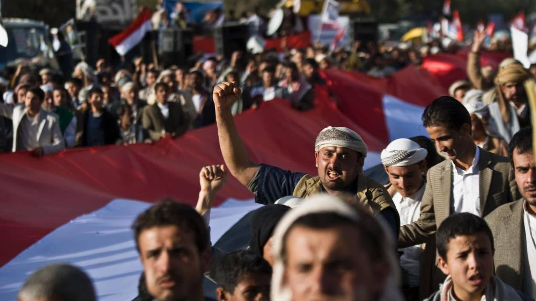 Feb. 11, 2015: Supporters of Houthi Shiites shout slogans while marching on a street as they celebrate the fourth anniversary of the uprising in Sanaa, Yemen. (AP)