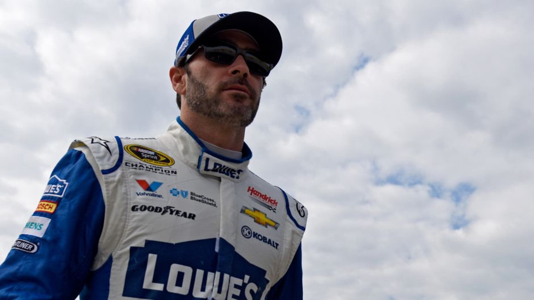 HOMESTEAD, FL - NOVEMBER 19: Jimmie Johnson, driver of the #48 Lowe's Chevrolet, walks through the garage area during practice for the NASCAR Sprint Cup Series Ford EcoBoost 400 at Homestead-Miami Speedway on November 19, 2016 in Homestead, Florida. (Photo by Jared C. Tilton/Getty Images)