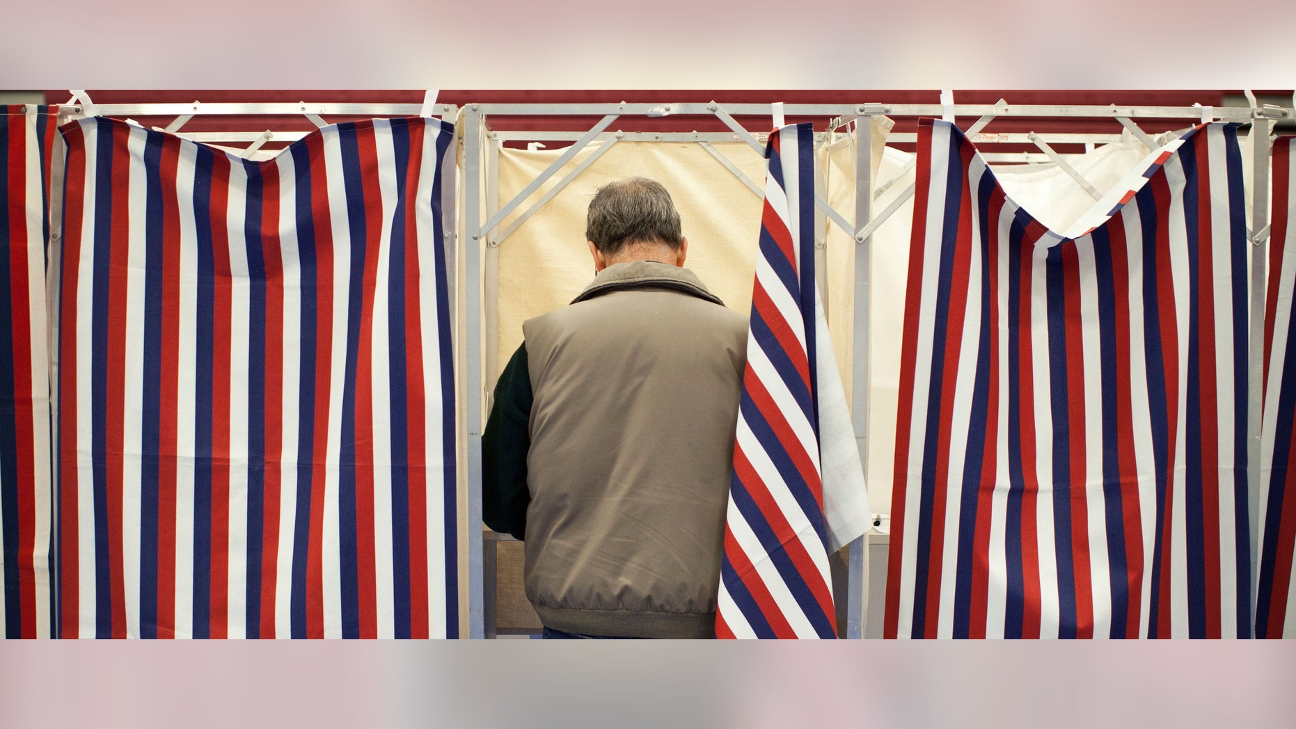 BEDFORD, NH - JANUARY 10: A man votes in the New Hampshire primary at Bedford High School on January 10, 2012 in Bedford, New Hampshire. Voters in New Hampshire headed to the polls in the nation's first primary election to pick their choice for a U.S. presidential candidate. (Photo by Andrew Burton/Getty Images)