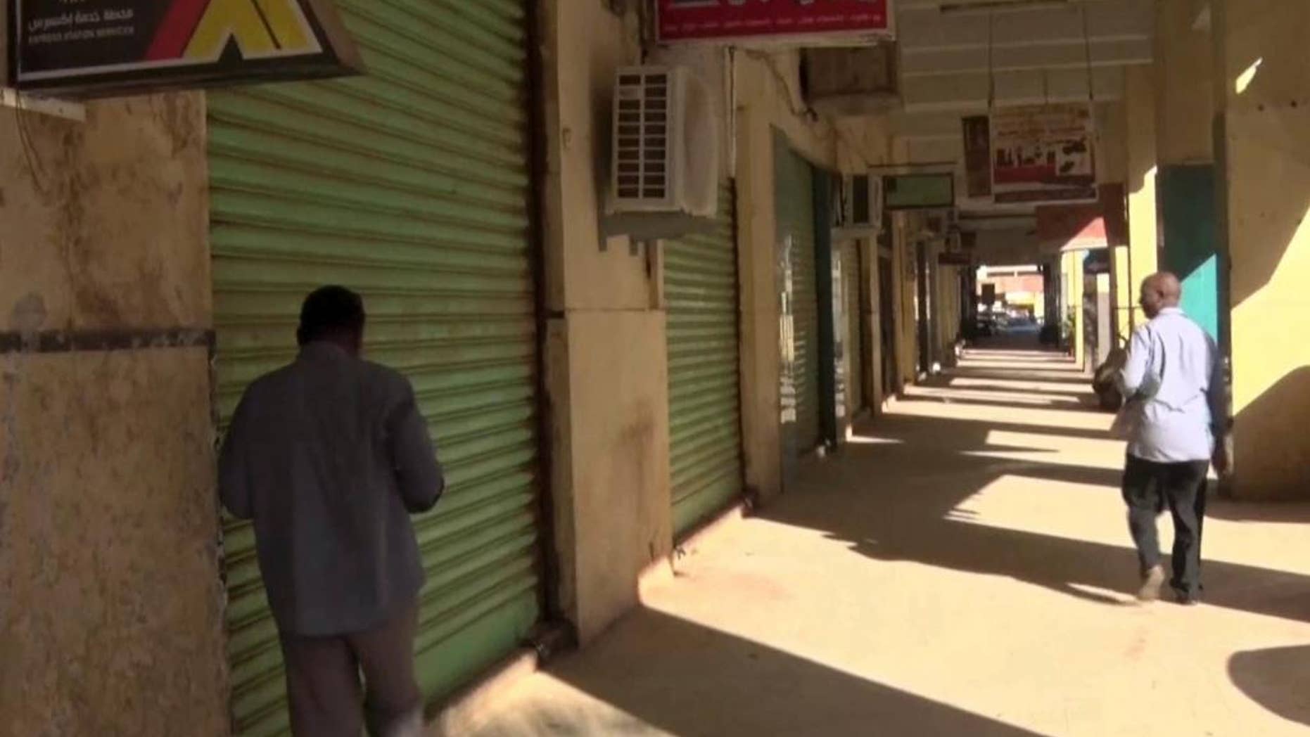 This still image taken from television footage, shows closed shops in Khartoum, Sudan, Tuesday, Nov. 29, 2016. Sudanese authorities have banned three more independent newspapers and seized all copies ahead of distribution as a general strike against fuel subsidy cuts and price hikes continued for the third day. (AP Photo)