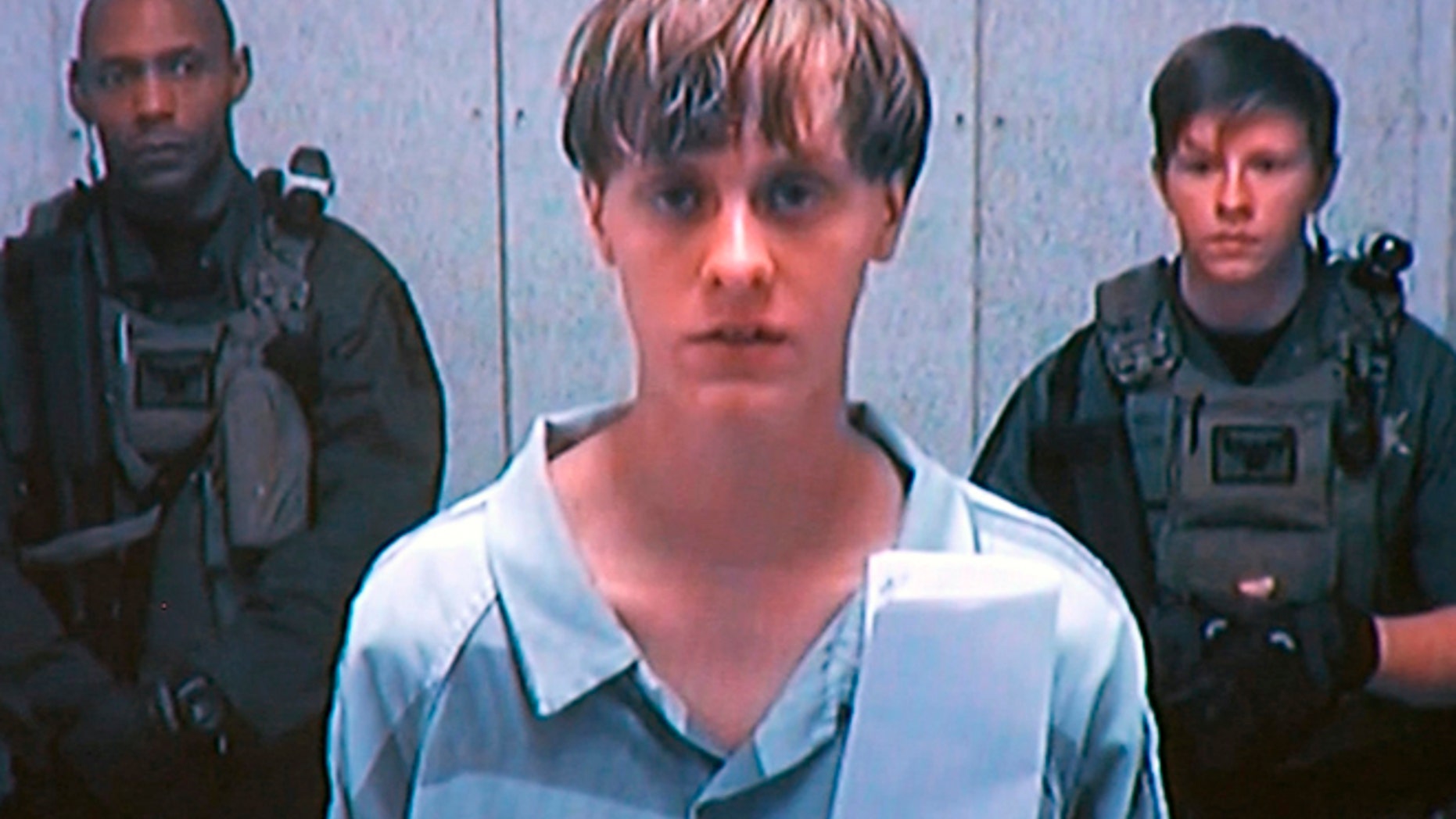 FILE: 2015: Dylann Storm Roof appeared by closed-circuit television at his initial bond hearing.