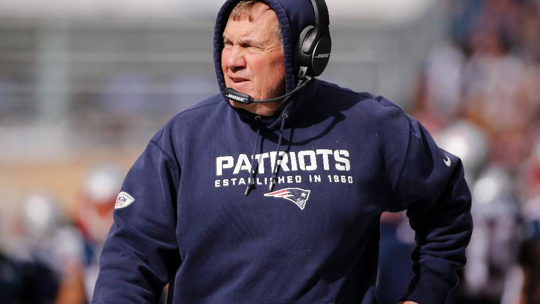 New England Patriots head coach Bill Belichick watches action from the sideline in the first half of an NFL football game against the Chicago Bears on Sunday, Oct. 26, 2014, in Foxborough, Mass. (AP Photo/Elise Amendola)