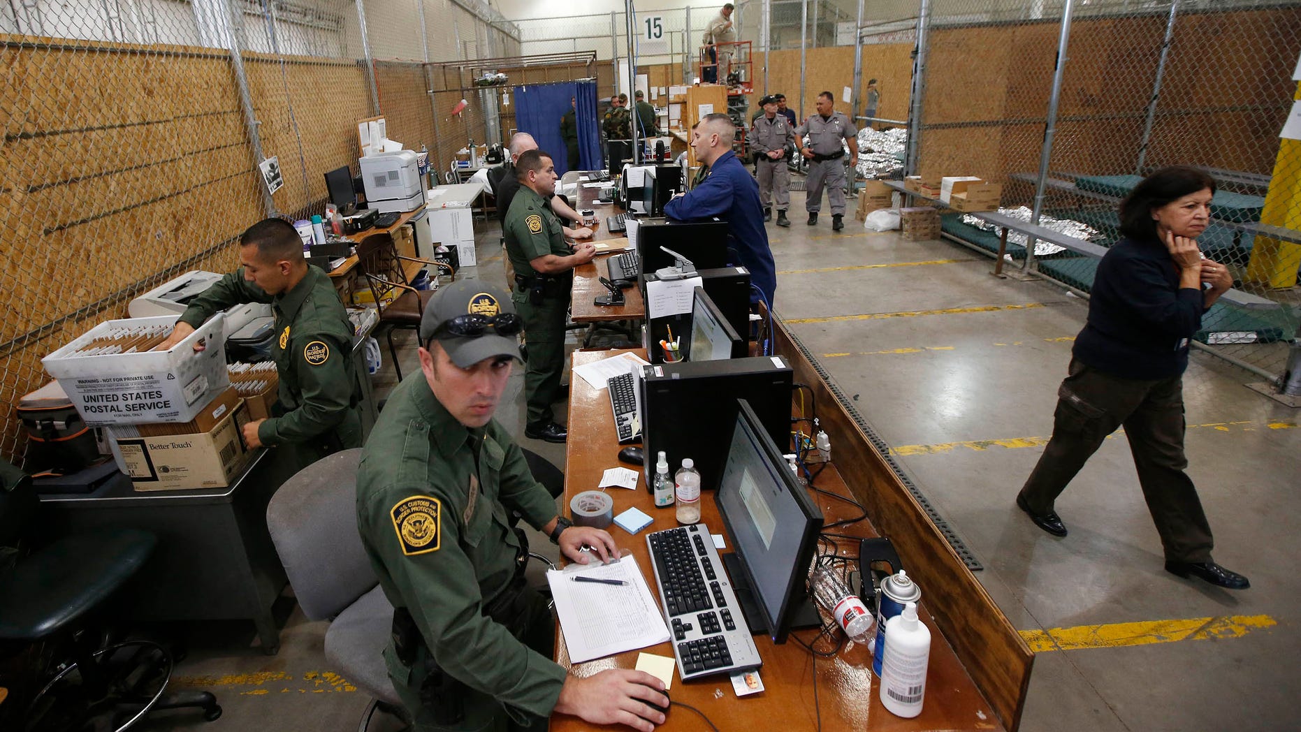 FILE: June 18, 2014: U.S. Customs and Border Protection at the Customs and Border Protection Nogales Placement Center in Nogales, Ariz.
