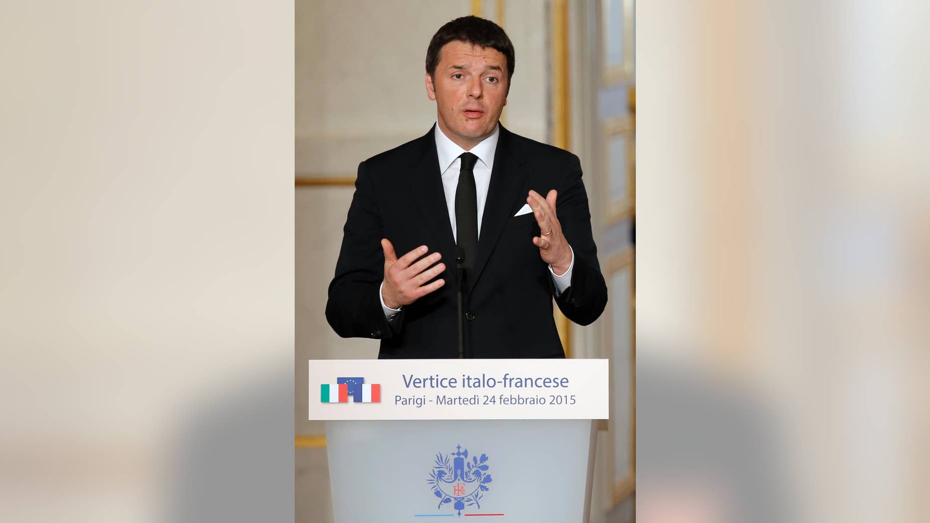 Italian Premier Matteo Renzi delivers his speech during a joint press conference with French President Francois Hollande ending the Franco-Italian summit at the Elysee Palace in Paris, France, Tuesday, Feb. 24, 2015. (AP Photo/Francois Mori, pool)