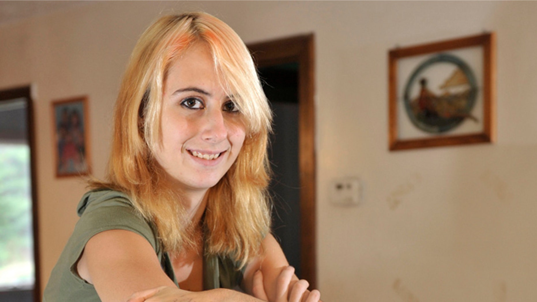 This Sept. 19, 2012 photo shows Whitney Kropp at her home in Alger, Mich.