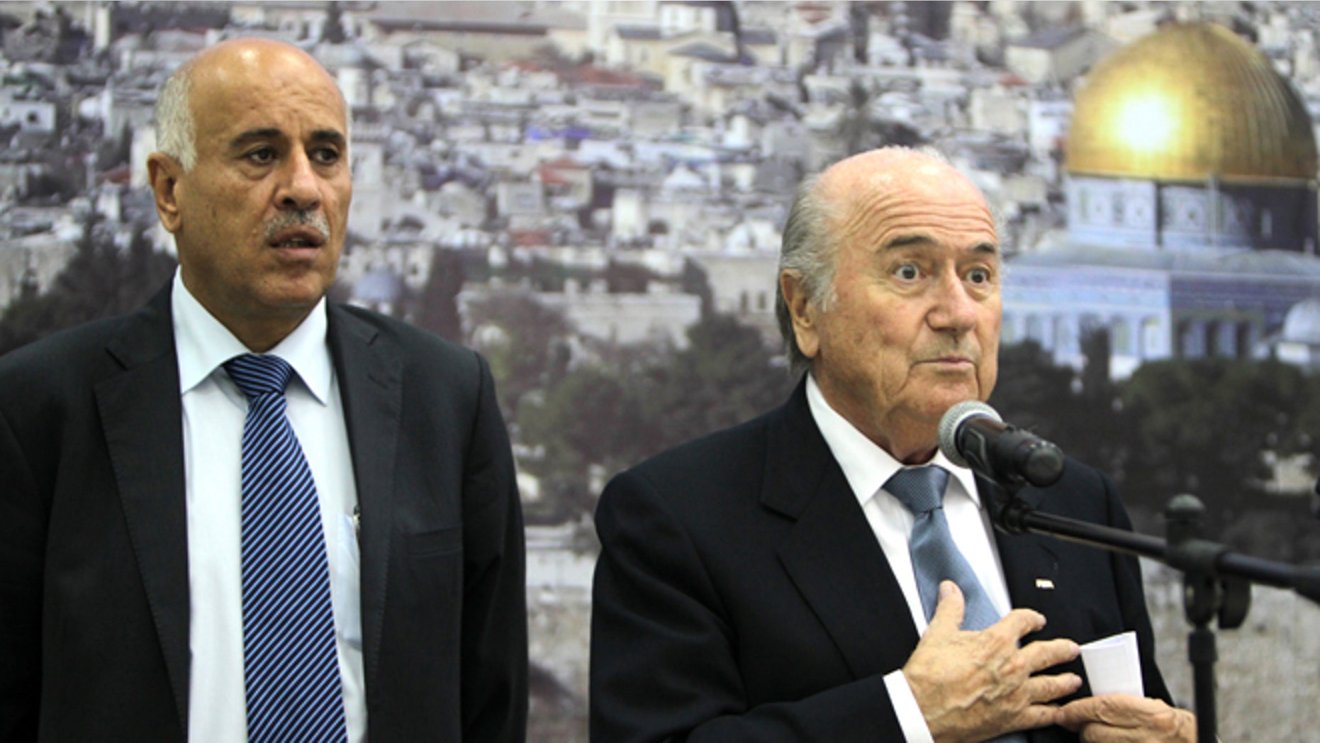 FIFA President Sepp Blatter (R) speaks as Palestinian Football Association chairman Jibril Rajoub listens on during a press conference in the West Bank city of Ramallah on July 7, 2013. Blatter is on a four-day-official visit to the Palestinian territories and Israel and neighboring Jordan during which he will notably launch football turf fields. AFP PHOTO/ABBAS MOMANI (Photo credit should read ABBAS MOMANI/AFP/Getty Images)