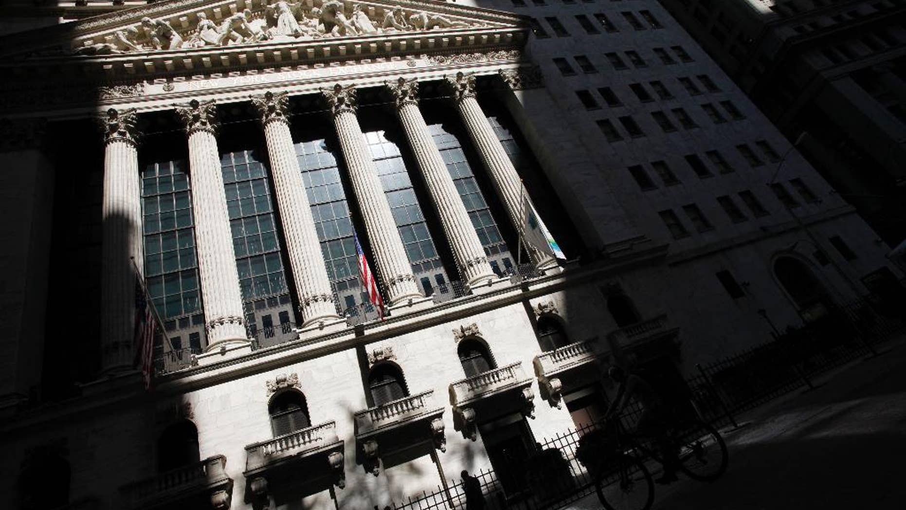 FILE - This July 15, 2013 file photo shows the New York Stock Exchange in New York. Worries over the timing of a U.S. rate hike, economic weakness in China and an impending referendum on Scottish independence kept a lid on global stock markets Wednesday, Sept. 10, 2014. (AP Photo/Mark Lennihan, File)