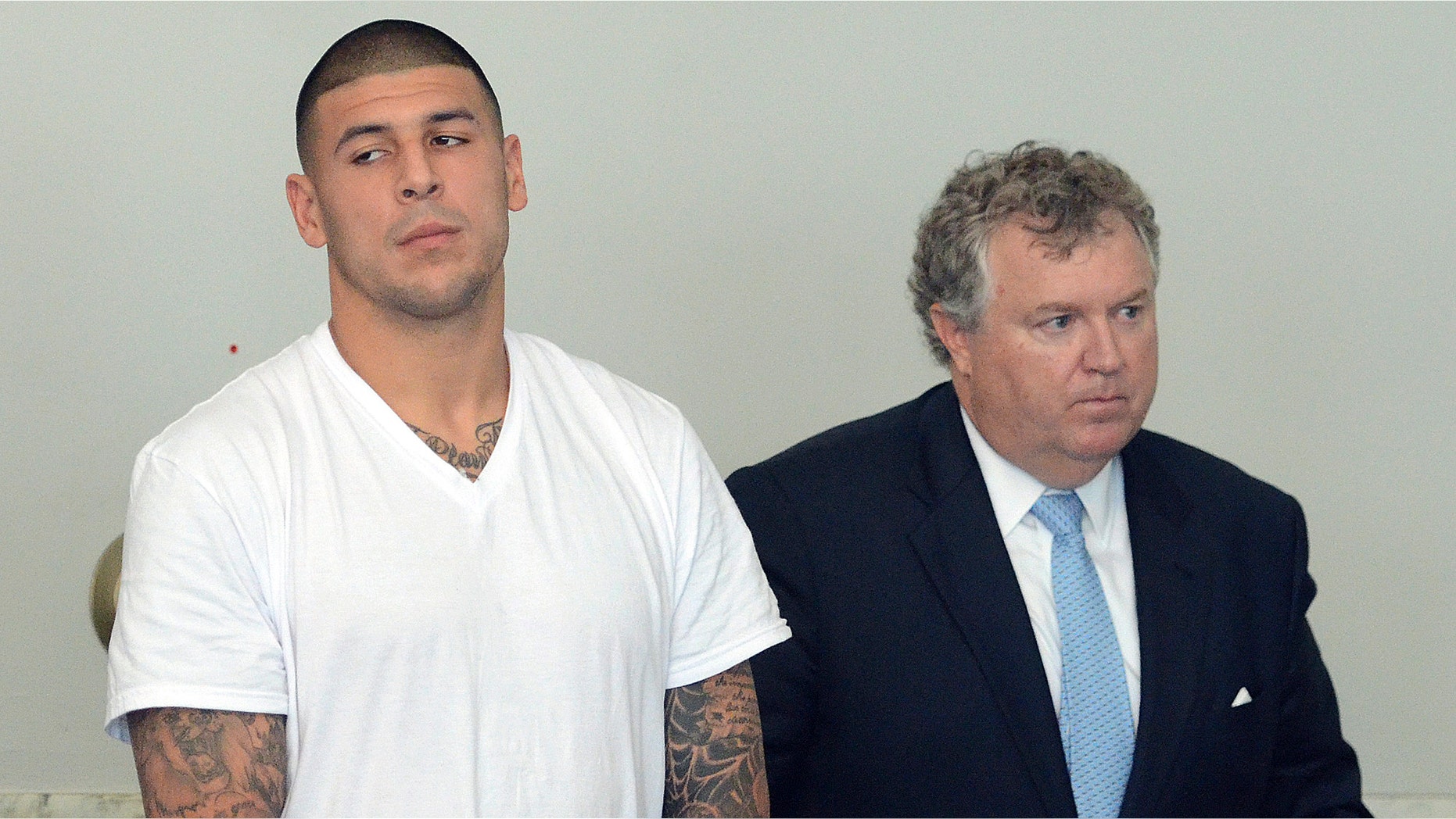 June 26, 2013: Former New England Patriots tight end Aaron Hernandez appears with his attorney Michael Fee, right, during an arraignment in Attleboro District Court in Attleboro, Mass. (AP)