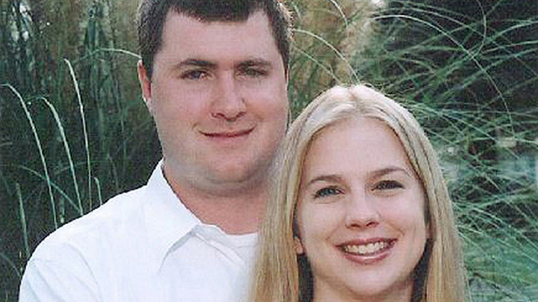 June 20, 2008: Gabe Watson, left, and his wife, Tina, pose on their engagement.