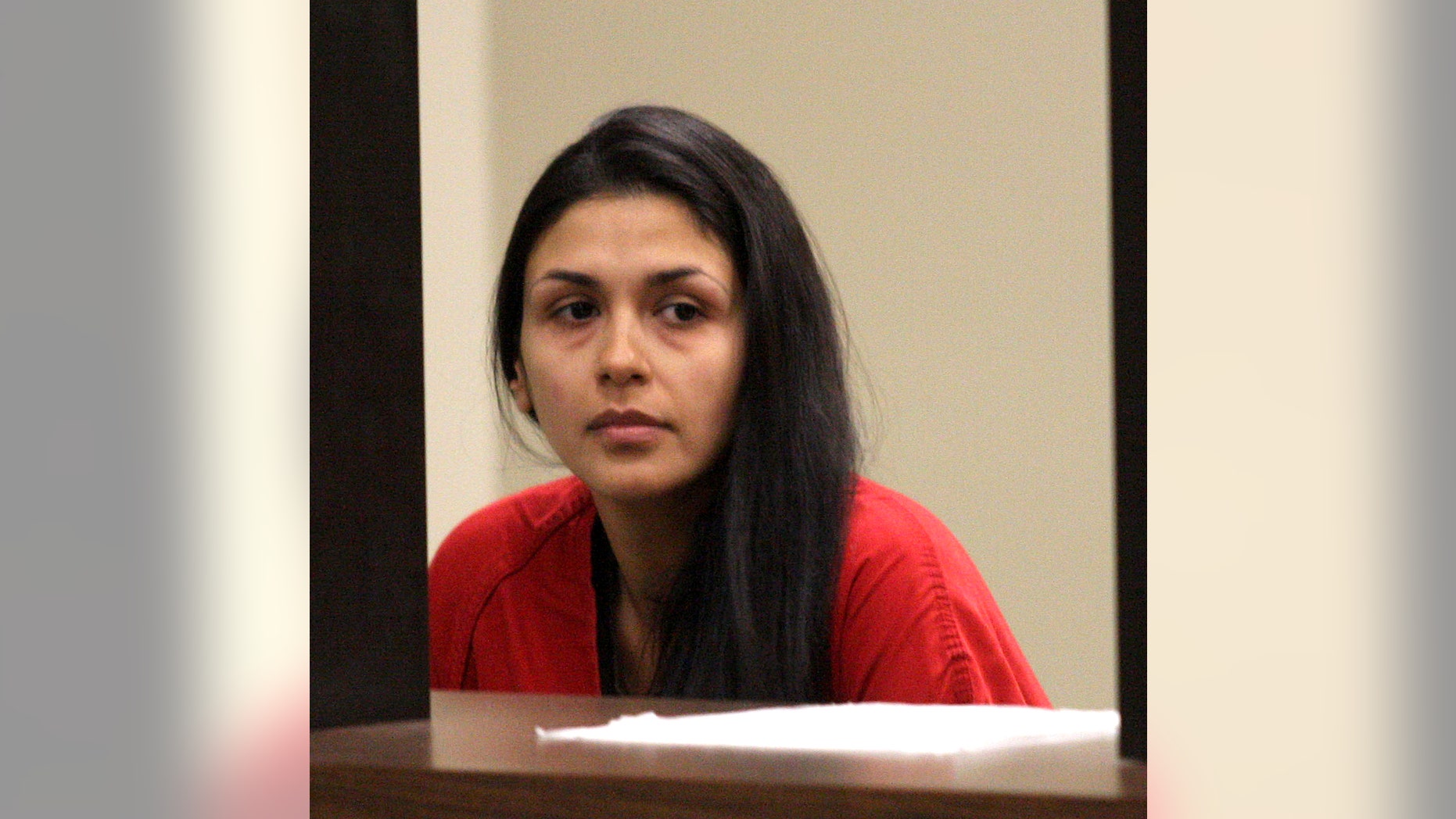 Lida Sharaf waits in the holding area at Superior Court for arraignment on felony and misdemeanor child abuse charges in Pleasanton, Calif., Thursday, April 25, 2013. The attorney for two Northern California women facing charges that they endangered infants' lives by binding them too tightly in swaddling blankets says the women did not intend to hurt the babies and maintain what they did was not abuse. Timothy Rien, the attorney for Nazila and Lida Sharaf, says the sisters contend they did not commit child abuse. Rien spoke Thursday, when the women were arraigned in a Contra Costa County courtroom on three counts of felony child abuse and neglect and four counts of misdemeanor child abuse and neglect. (AP Photo/Bay Area News Group, Jim Stevens)