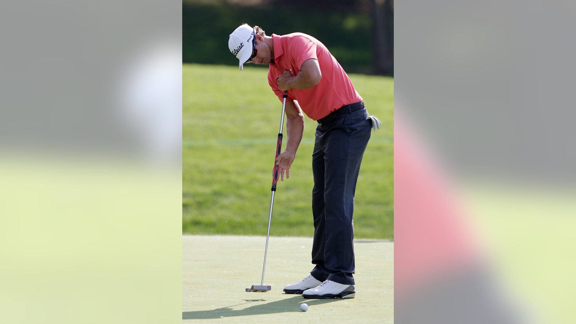 Adam Scott, of Australia, putts during the pro-am of the Memorial golf tournament Wednesday, May 29, 2013, in Dublin, Ohio. (AP Photo/Jay LaPrete)