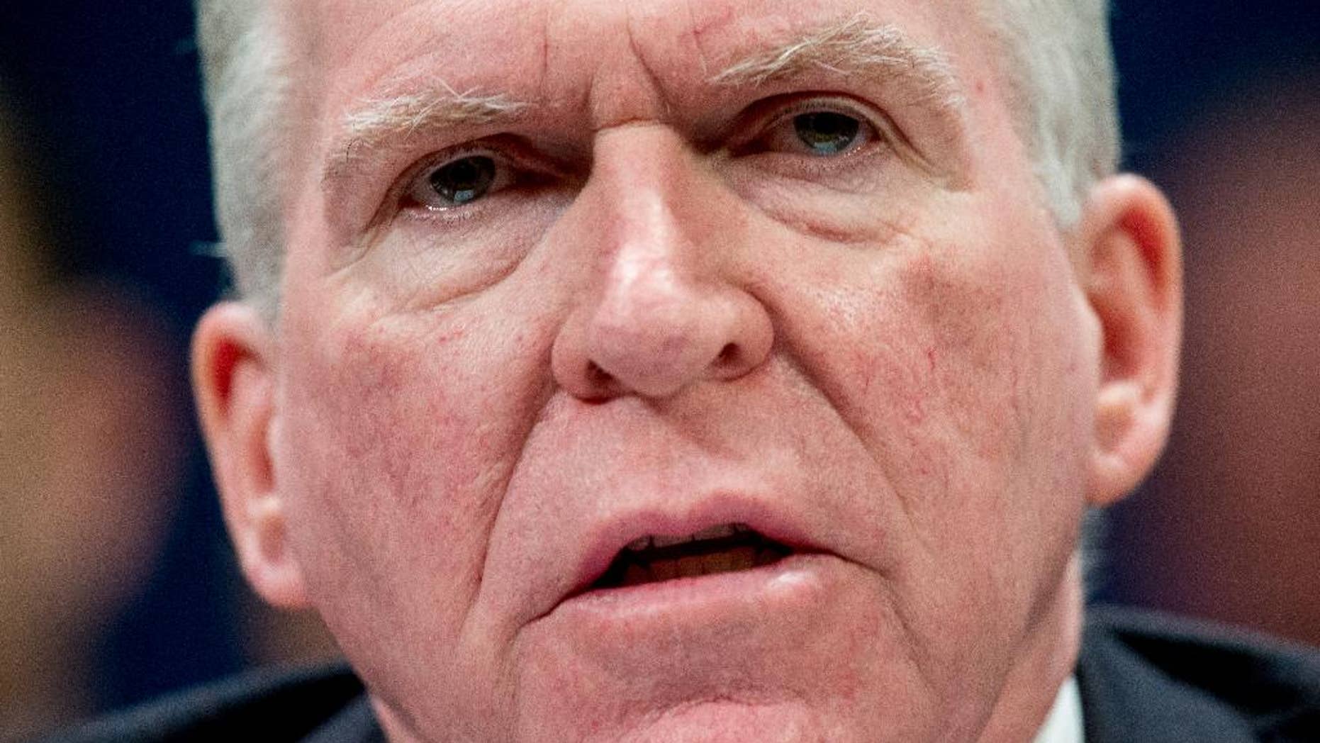 FILE - In this Feb. 25, 2016, file photo, CIA Director John Brennan speaks at a House Intelligence Committee hearing on world wide threats on Capitol Hill in Washington. Brennan will tell Congress on June 16, that Islamic State militants are training and attempting to deploy operatives for further attacks on the West and will rely more on guerrilla-style tactics to compensate for its territorial losses. (AP Photo/Andrew Harnik)