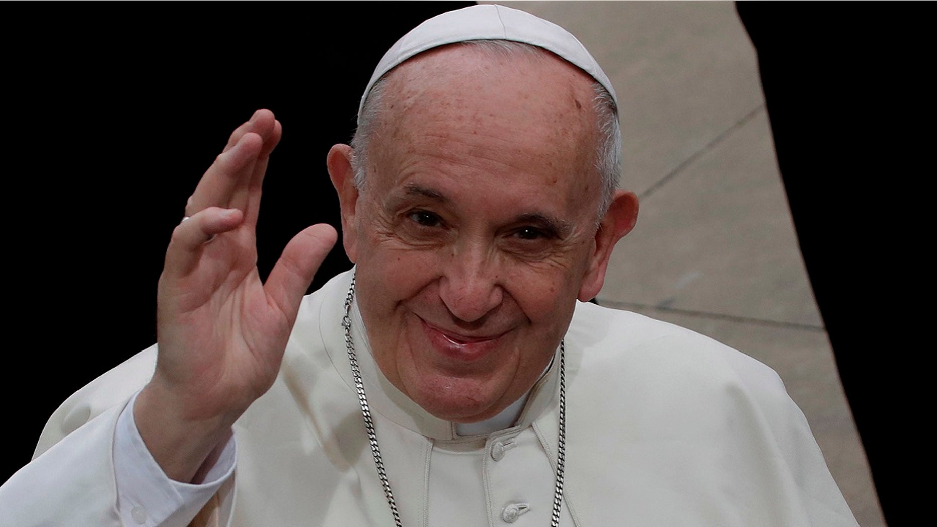 Pope Francis waves during his visit to the parish church of San Paolo della Croce, in Corviale neighborhood, Rome, Sunday, April 15, 2018.