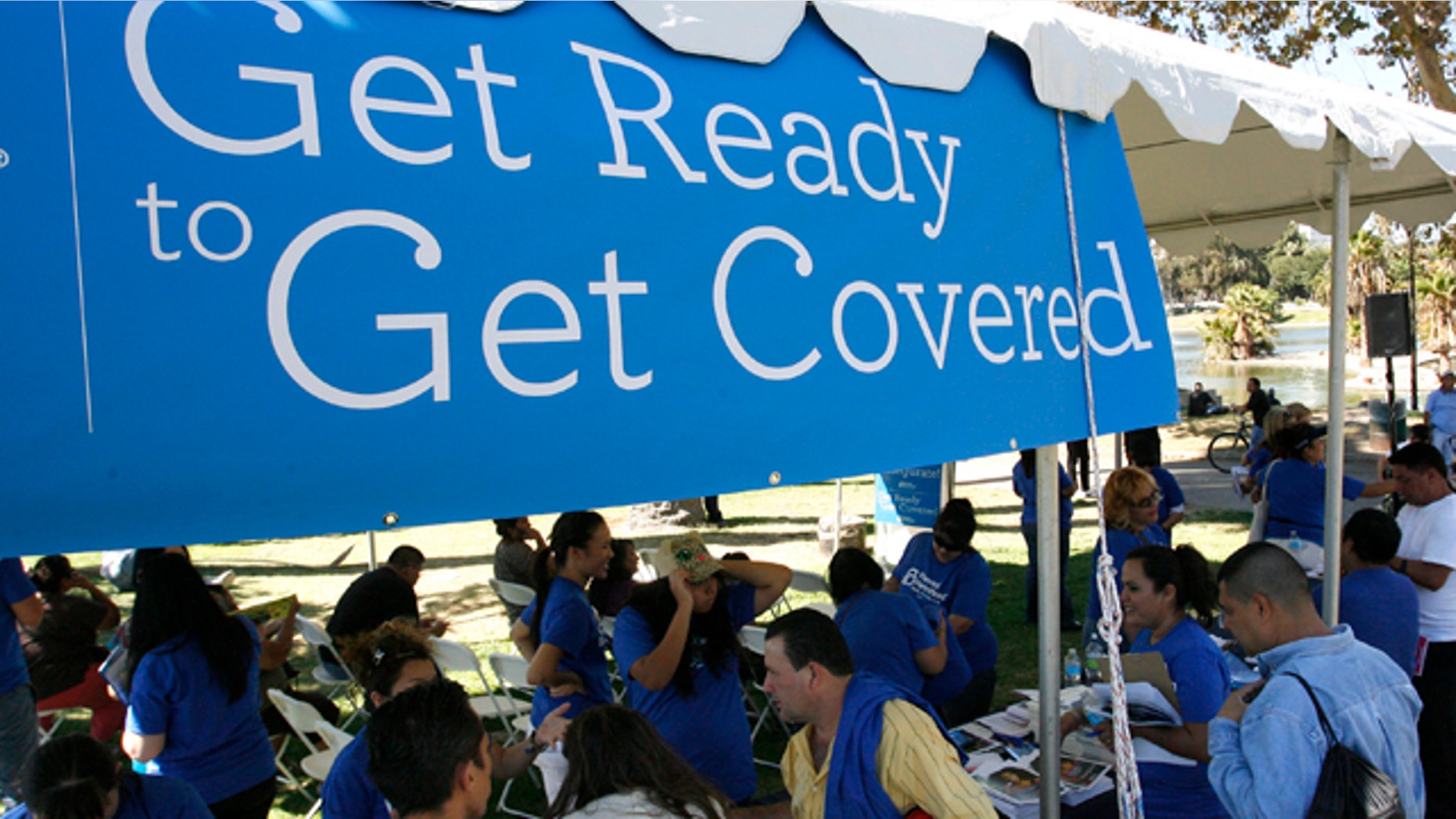 September 28, 2013: People gather for information during a Planned Parenthood Affordable Care Act outreach event.