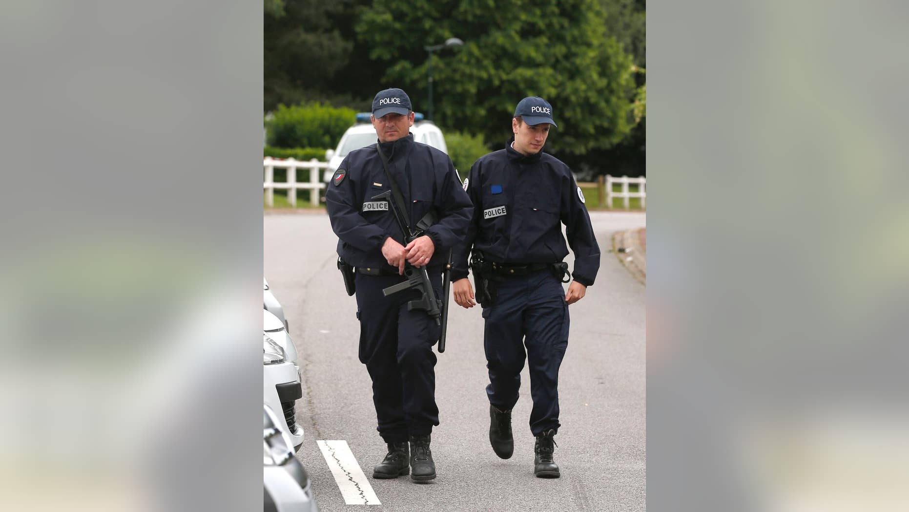 June 14, 2016: French police officers block the road leading to a crime scene the day after a knife-wielding attacker stabbed a senior police officer to death Monday evening outside his home in Magnanville, west of Paris, France.