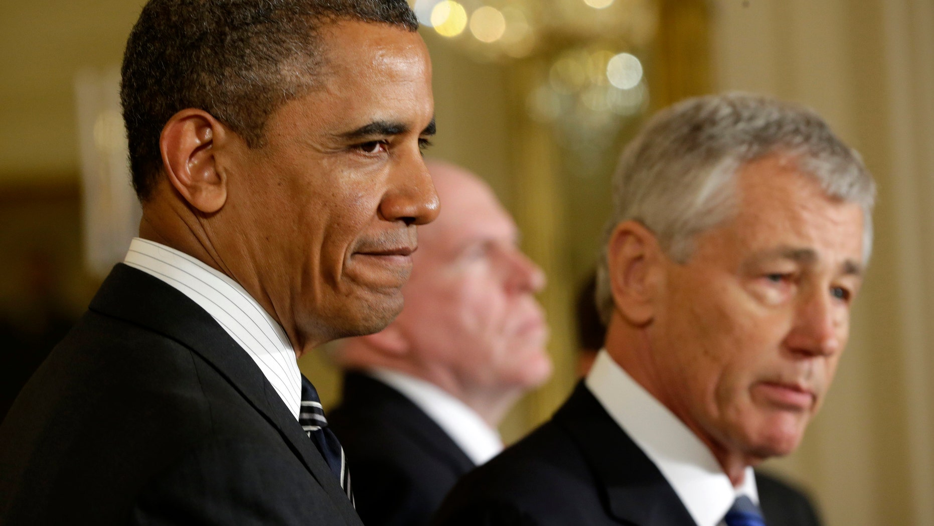 President Barack Obama listens in the East Room of the White House in Washington, Monday, Jan. 7, 2013, where he announced that he is nominating Deputy National Security Adviser for Homeland Security and Counterterrorism, John Brennan, center, as the new CIA director; and former Nebraska Sen. Chuck Hagel, right, as the new defense secretary.(AP Photo/Pablo Martinez Monsivais)