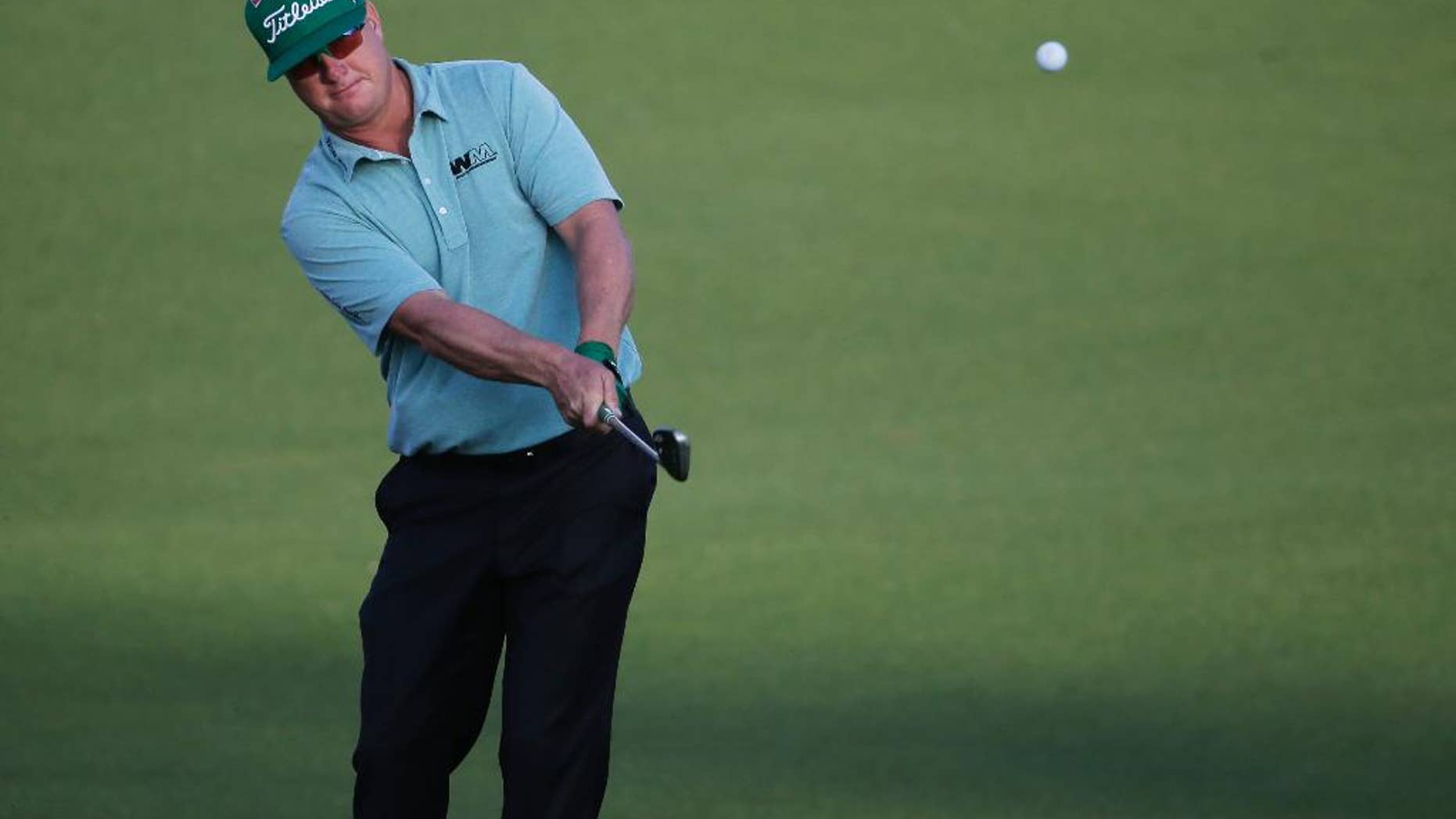 Charley Hoffman hits on the first fairway during the first round of the Masters golf tournament Thursday, April 9, 2015, in Augusta, Ga. (AP Photo/Chris Carlson)