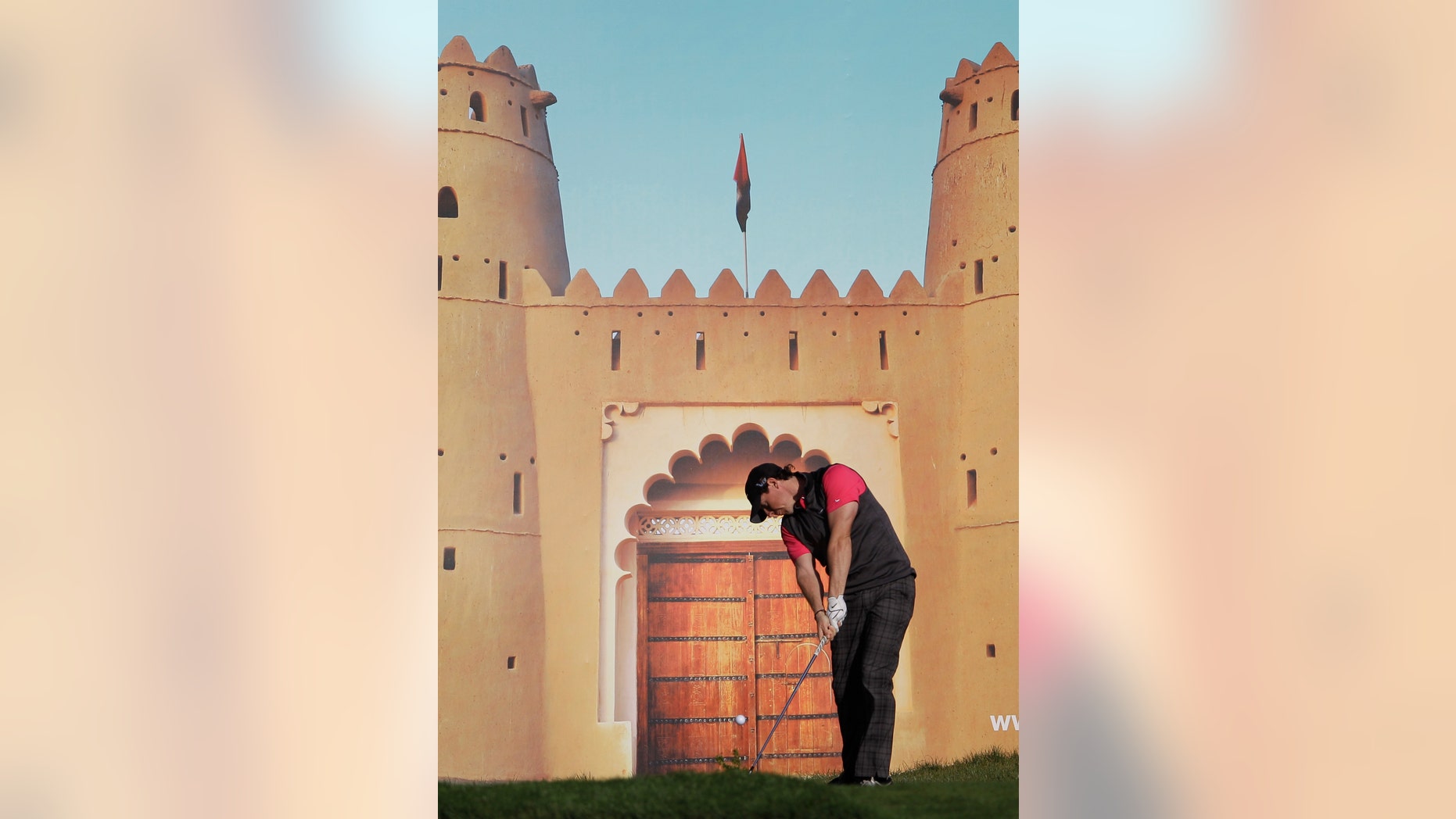 Rory McIlroy from Northern Ireland tees off on the 15th hole during the first round of Abu Dhabi Golf Championship in Abu Dhabi, United Arab Emirates, Thursday, Jan. 17, 2012. (AP Photo/Kamran Jebreili)