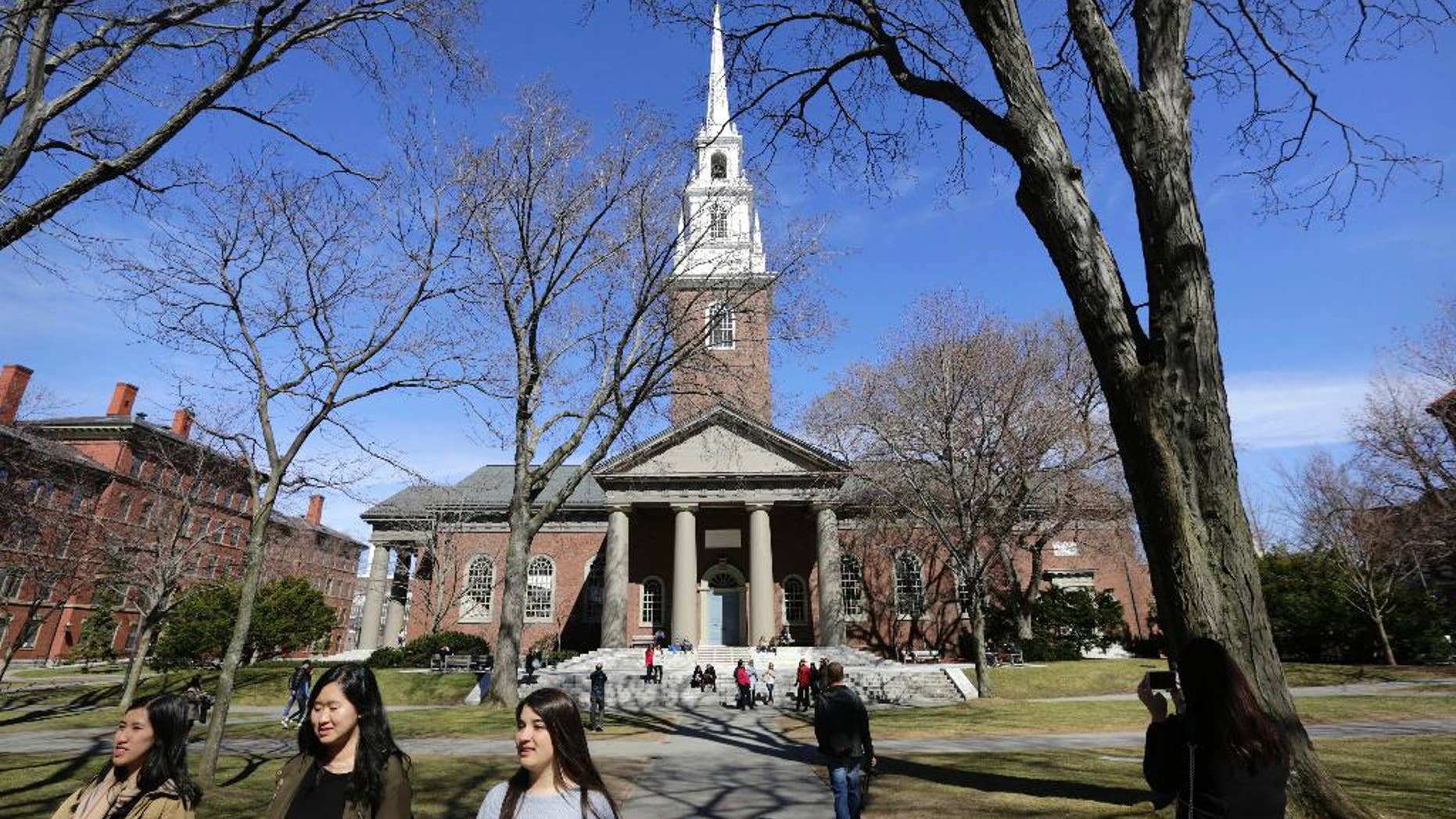 March 13, 2016: People walk near Memorial Church on the campus of Harvard University in Cambridge, Mass.