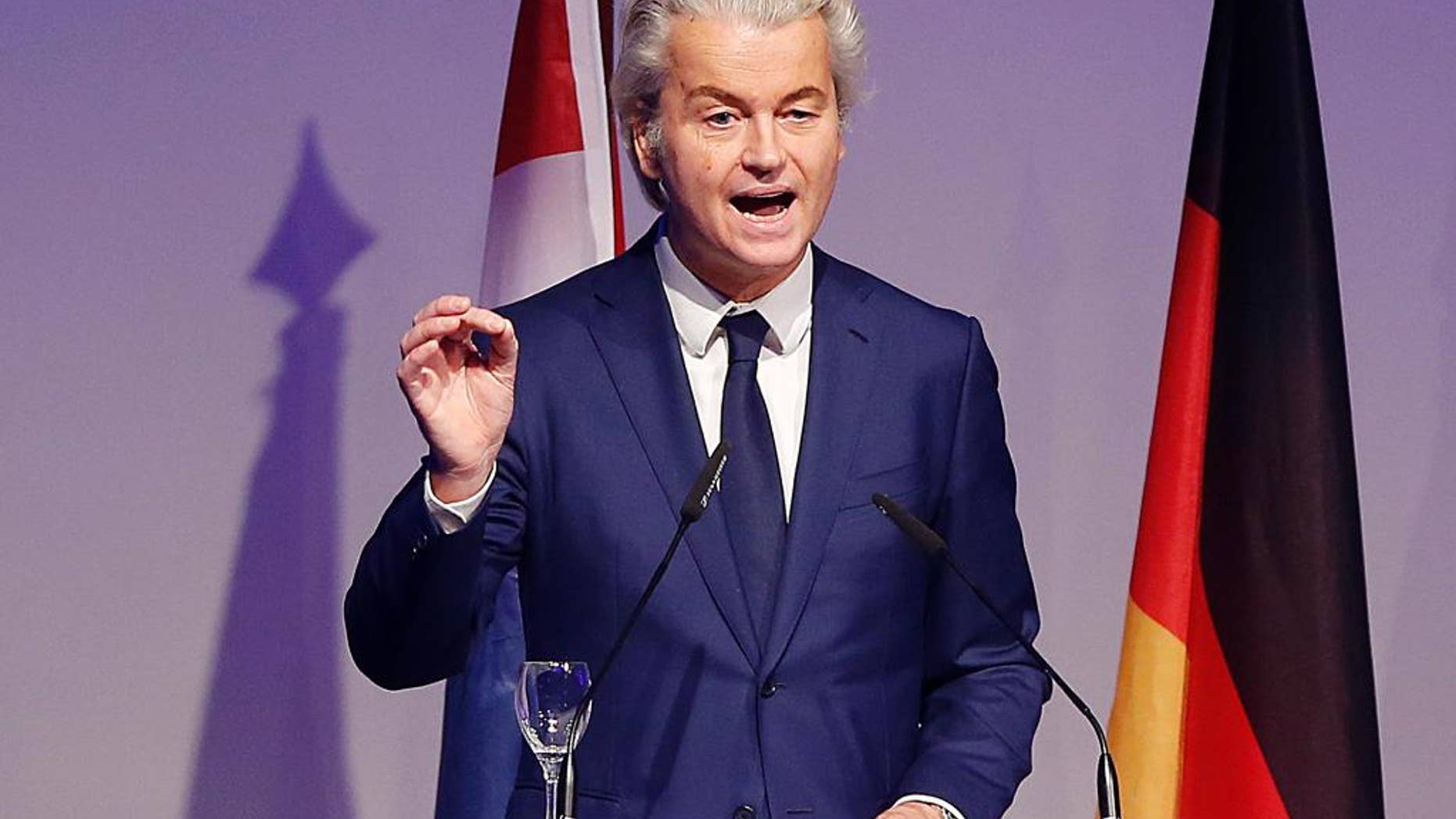 FILE - In this Saturday, Jan. 21, 2017 file photo, Dutch populist anti-Islam lawmaker Geert Wilders delivers a speech at a meeting of European Nationalists in Koblenz, Germany. Wilders clashed in the Dutch Parliament Tuesday, Jan. 31, 2017 with the Dutch foreign minister over U.S. President Donald Trump's travel ban for people from seven Muslim nations. (AP Photo/ Michael Probst, file)
