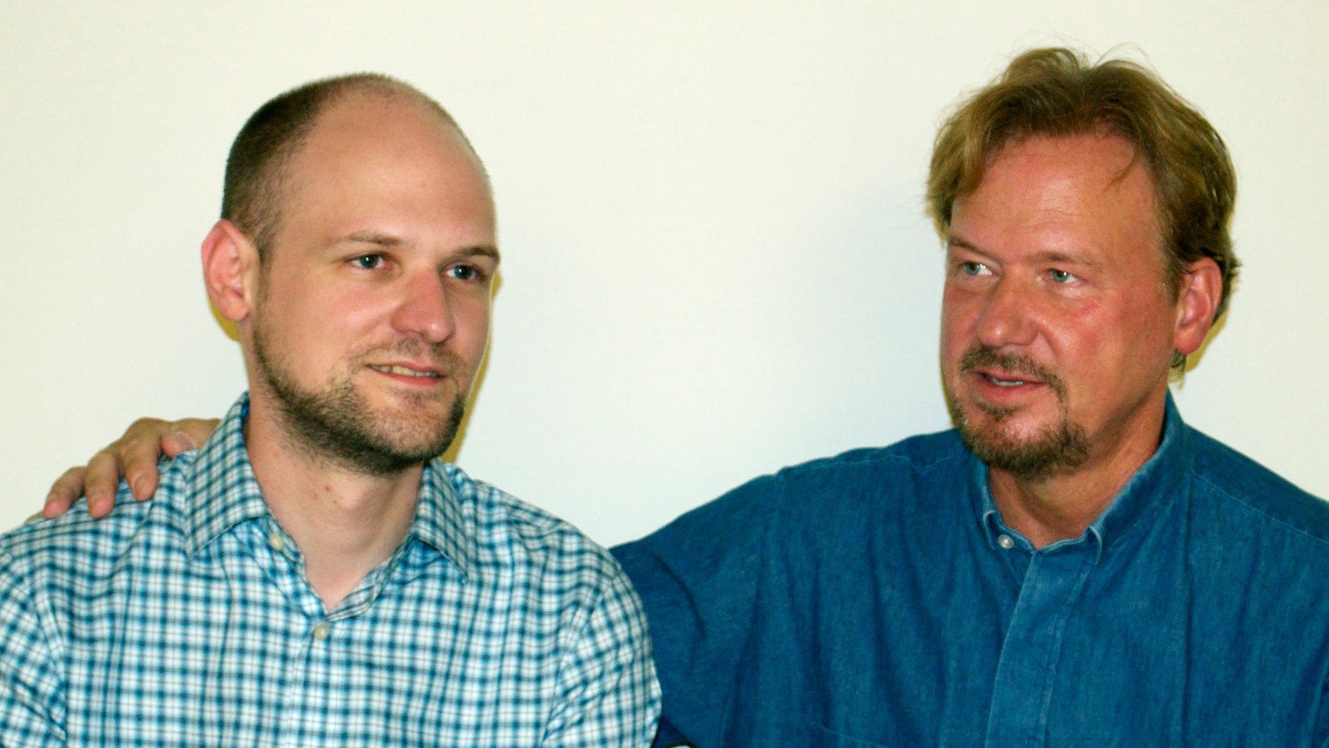 FILE - This Sept. 2013 photo provided by The Rev. Frank Schaefer shows Schaefer, right, and his son Tim. The Rev. Frank Schaefer, 51, charged under United Methodist law with officiating Tim's same-sex marriage, is scheduled to go on trial Monday, Nov. 18, 2013. The pastor could be defrocked if a jury comprised of fellow Methodist clergy convicts him of breaking his pastoral vows by officiating the 2007 ceremony in Massachusetts. Schaefer's supporters argue that church teaching on homosexuality is outmoded. (AP Photo/ Schaefer Family, File)