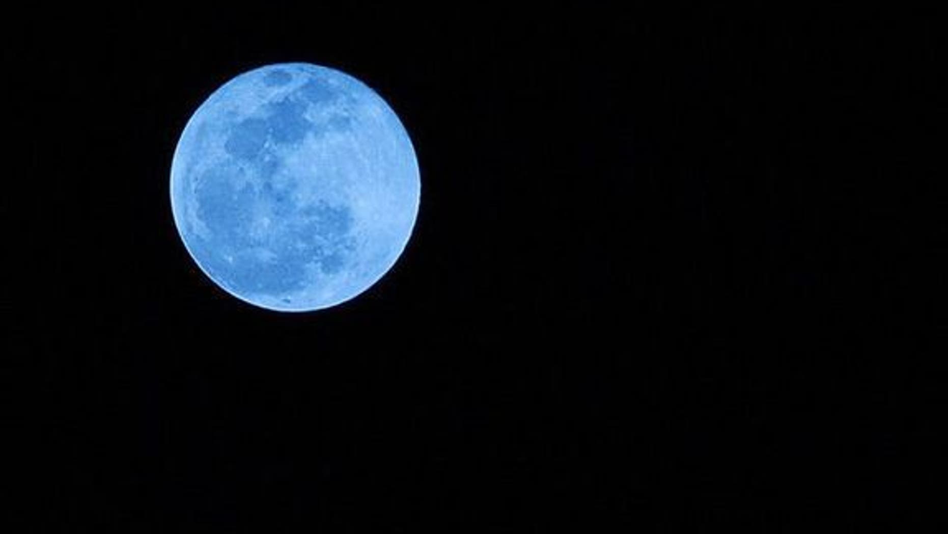 This photo of a blue moon was taken from Boca Raton, Fla., on New Year's Eve 2009. Blue moons aren't actually blue-hued, though that's not to say humans haven't seen blue and even green moons.