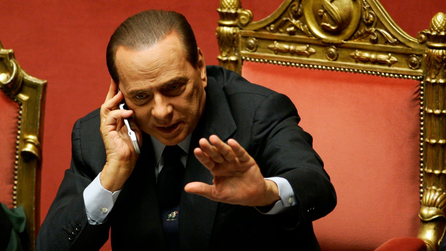 FILE - In this Tuesday, Dec. 14, 2010 file photo, Silvio Berlusconi gestures as he speaks on a mobile phone prior to a parliament debate, at the Senate in Rome, Italy. Berlusconi is among the world leaders who are trying to cope following allegations of massive electronic monitoring by the U.S. National Security Agency (AP Photo/Riccardo De Luca, File)