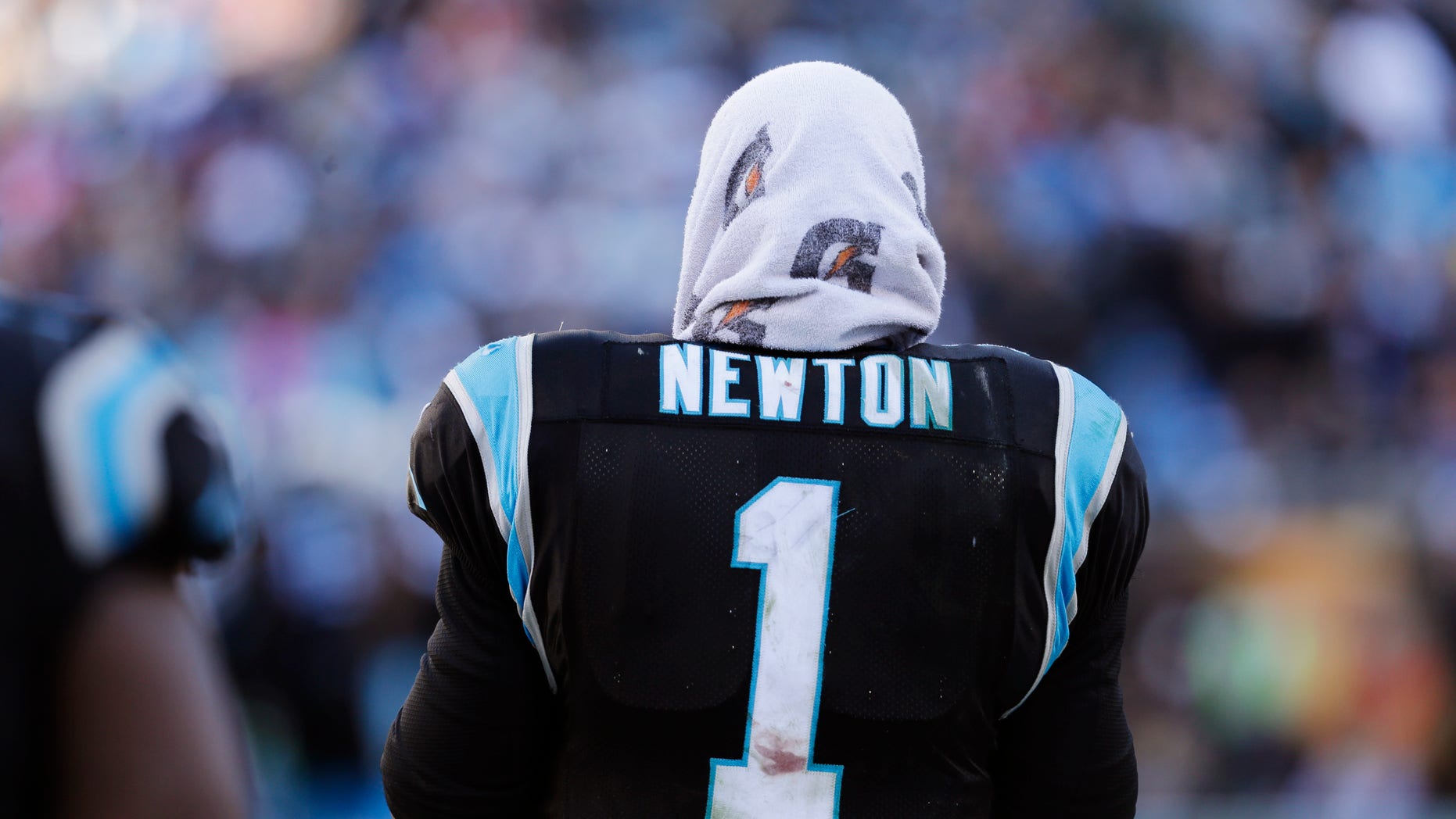 Carolina Panthers quarterback Cam Newton (1) stands on the sideline during the second half of a divisional playoff NFL football game against the San Francisco 49ers, Sunday, Jan. 12, 2014, in Charlotte, N.C. (AP Photo/Chuck Burton)