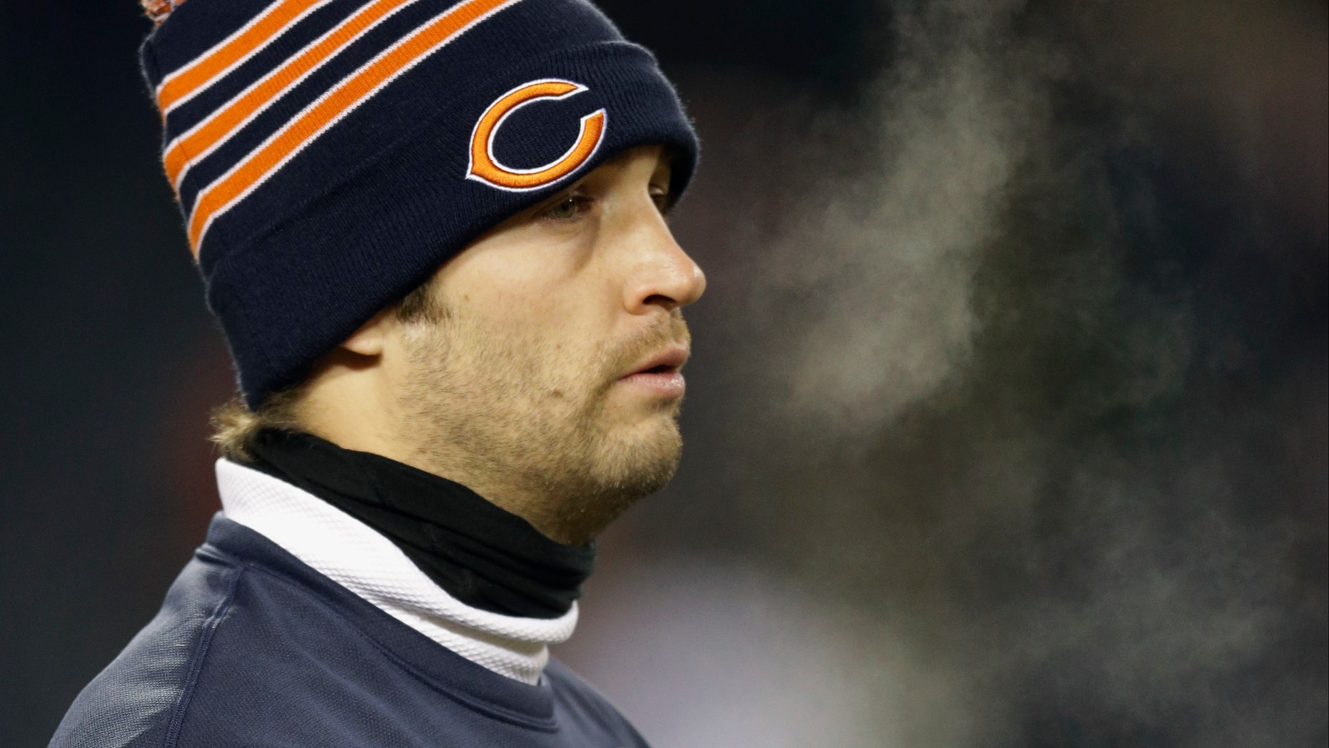 Injured Chicago Bears quarterback Jay Cutler walks around the field during team warmups before an NFL football game between the Bears and the Dallas Cowboys, Monday, Dec. 9, 2013, in Chicago. (AP Photo/Nam Y. Huh)