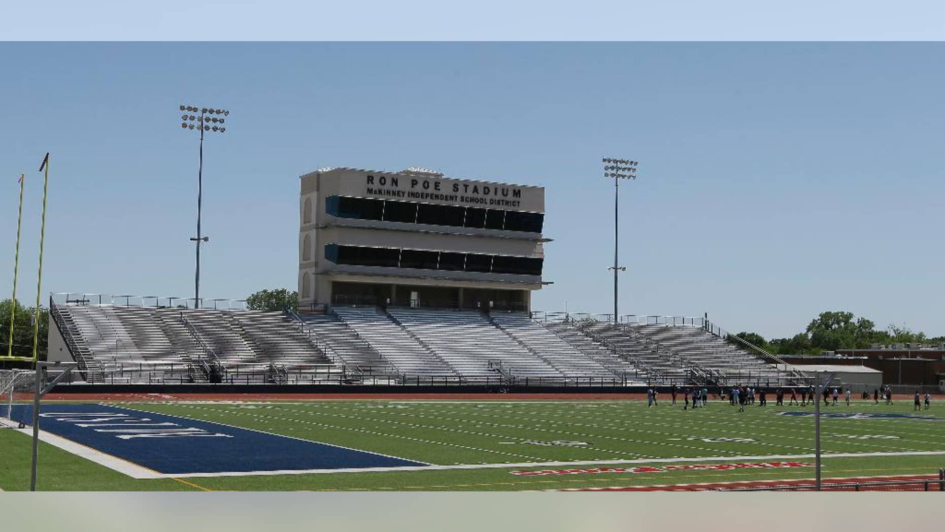 FILE - In this April 28, 2016, file photo, middle schoolers use the field in Ron Poe Stadium in McKinney, Texas. Voters in McKinney Independent School District approved a bond issue Saturday, May 7, 2016, to build a new high school football stadium. (AP Photo/LM Otero, File)