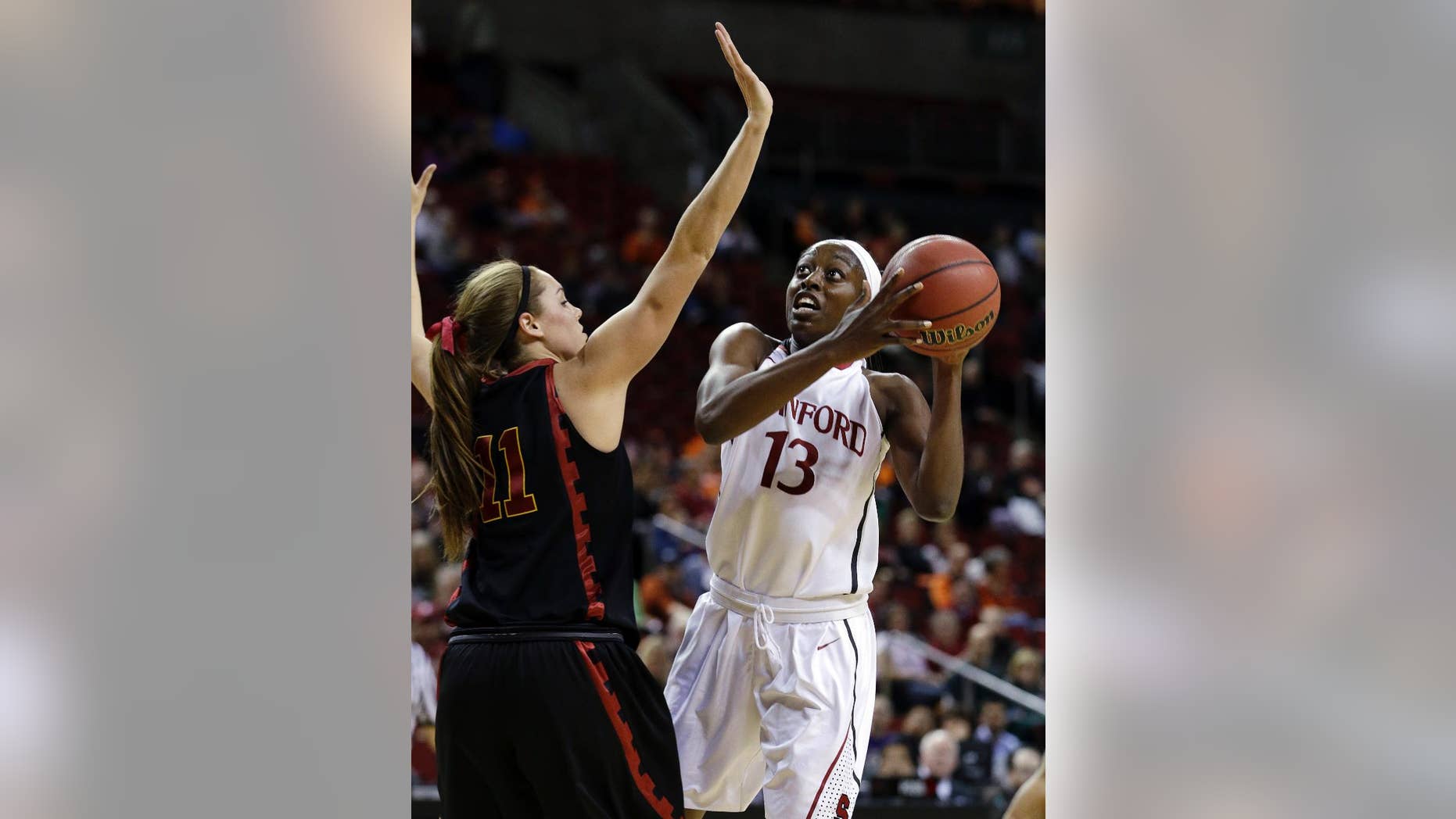 Stanford's Chiney Ogwumike (13) shoots against Southern California's Cassie Harberts in the first half of an NCAA college basketball game in the Pac-12 women's tournament Saturday, March 8, 2014, in Seattle. (AP Photo/Elaine Thompson)