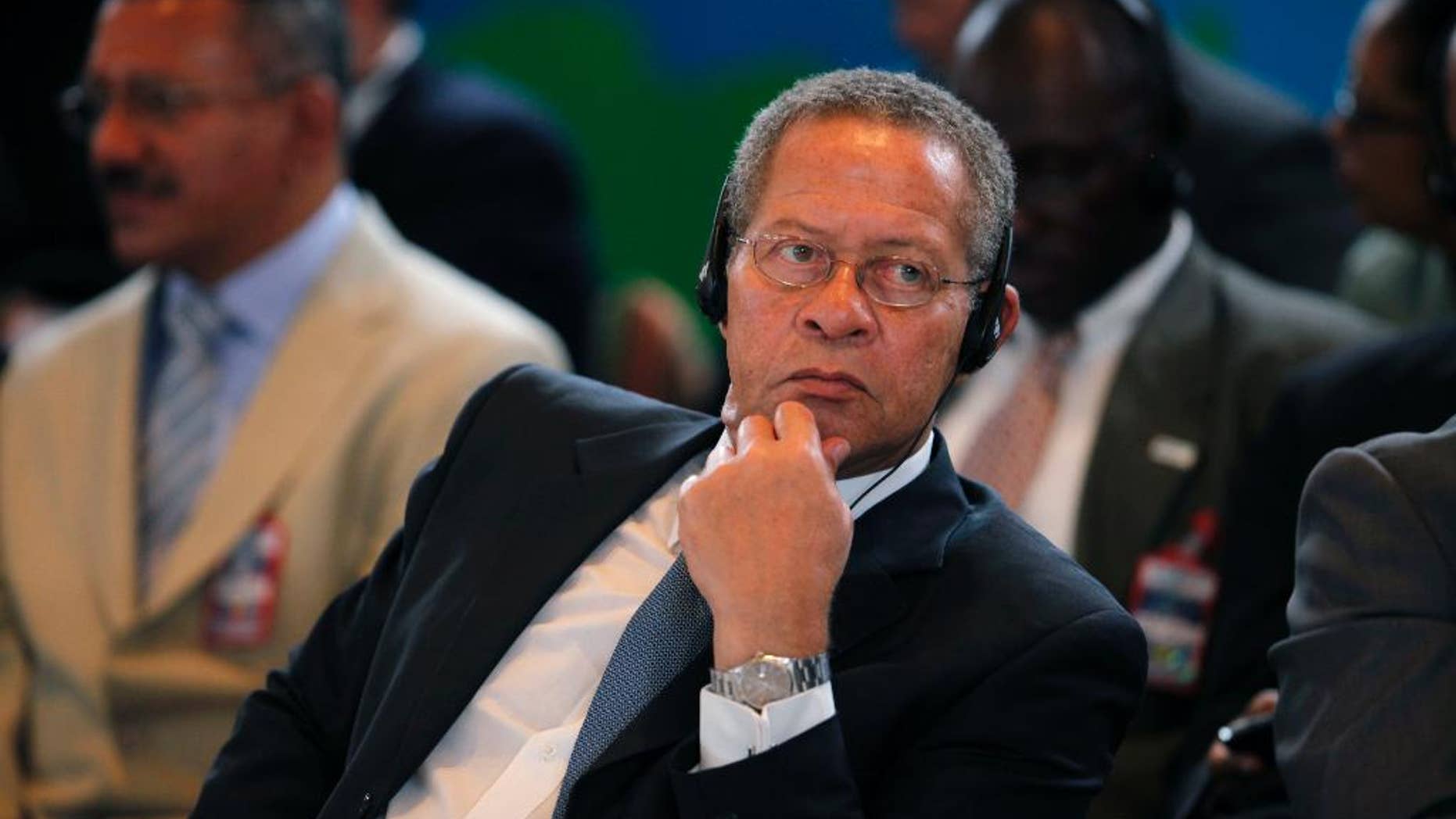 FILE - In this June 12, 2009 file photo, Jamaica's Prime Minister Bruce Golding listens to a speech during the Petrocaribe Summit, in Frigate Bay, St. Kitts. The former prime minister testified Monday, Feb. 9, 2015, that he personally knew the underworld boss Christopher "Dudus" Coke who ran a notorious slum fiefdom from his parliamentary constituency but stopped communicating with him roughly three years before the U.S. sought his extradition. (AP Photo/Brennan Linsley, File)