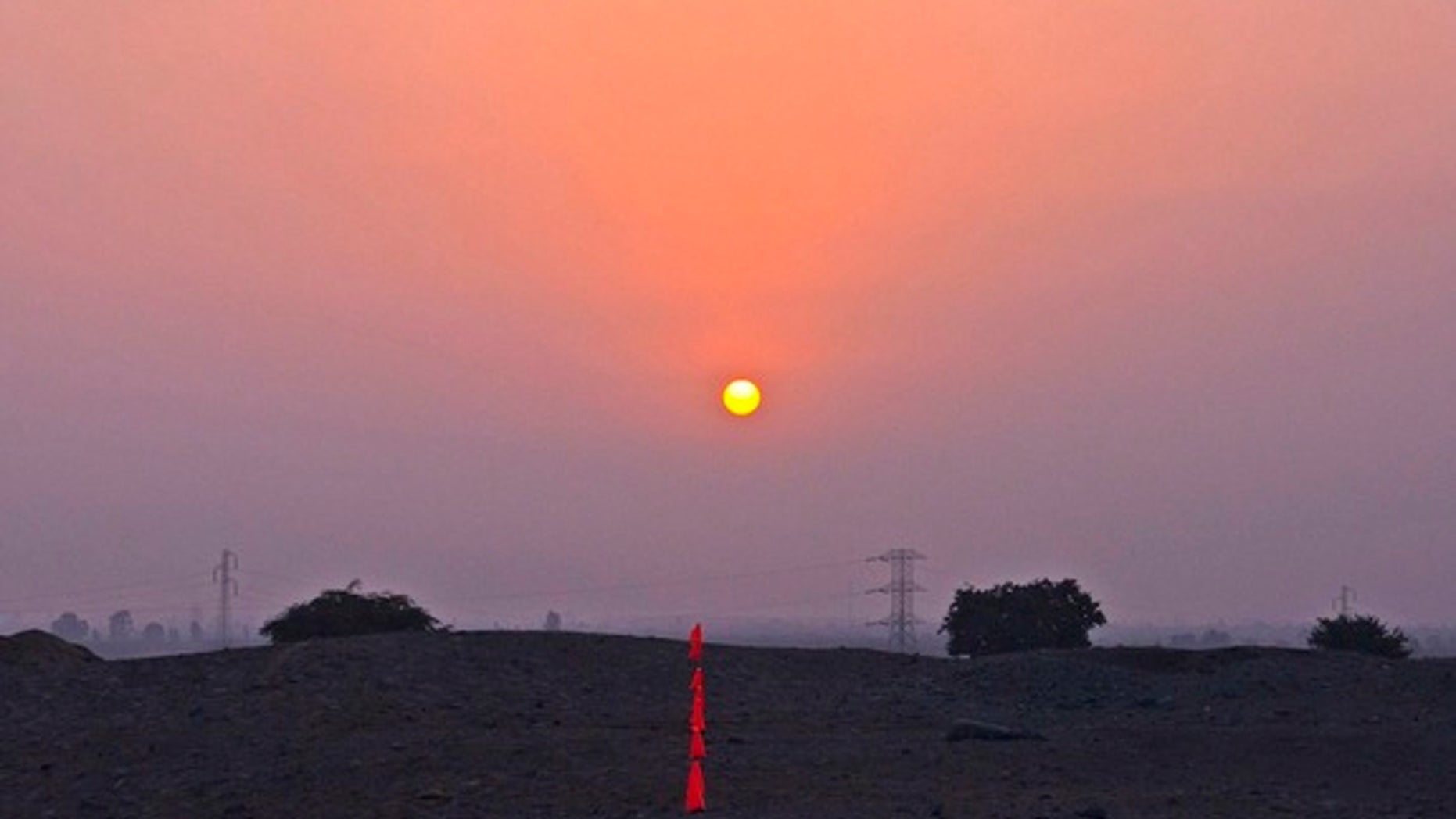 Chinca Valley's Mono B, a 66-foot by 75-foot U-shaped mound, on the day before solstice (June 20) in 2013. A marker points to the solstice sunset.