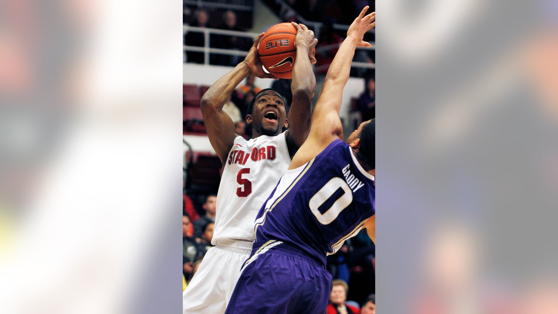 Stanford's Chasson Randle shoots over Washington's Abdul Gaddy during the first half of an NCAA college basketball game, Saturday, Jan. 12, 2013 in Berkeley, Calif. (AP Photo/George Nikitin)