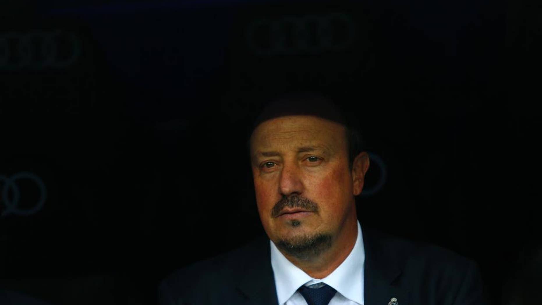 Real Madrid's head coach Rafa Benitez waits for the start of the game during the Spanish La Liga soccer match between Real Madrid and Getafe at the Santiago Bernabeu stadium in Madrid, Saturday, Dec. 5, 2015. Real Madrid won 4-1. (AP Photo/Francisco Seco)
