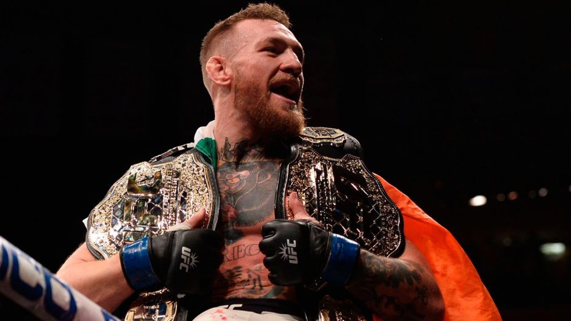 NEW YORK, NY - NOVEMBER 12: Conor McGregor of Ireland celebrates his victory over Eddie Alvarez in their UFC lightweight championship fight during the UFC 205 event at Madison Square Garden on November 12, 2016 in New York City. (Photo by Brandon Magnus/Zuffa LLC/Zuffa LLC via Getty Images)