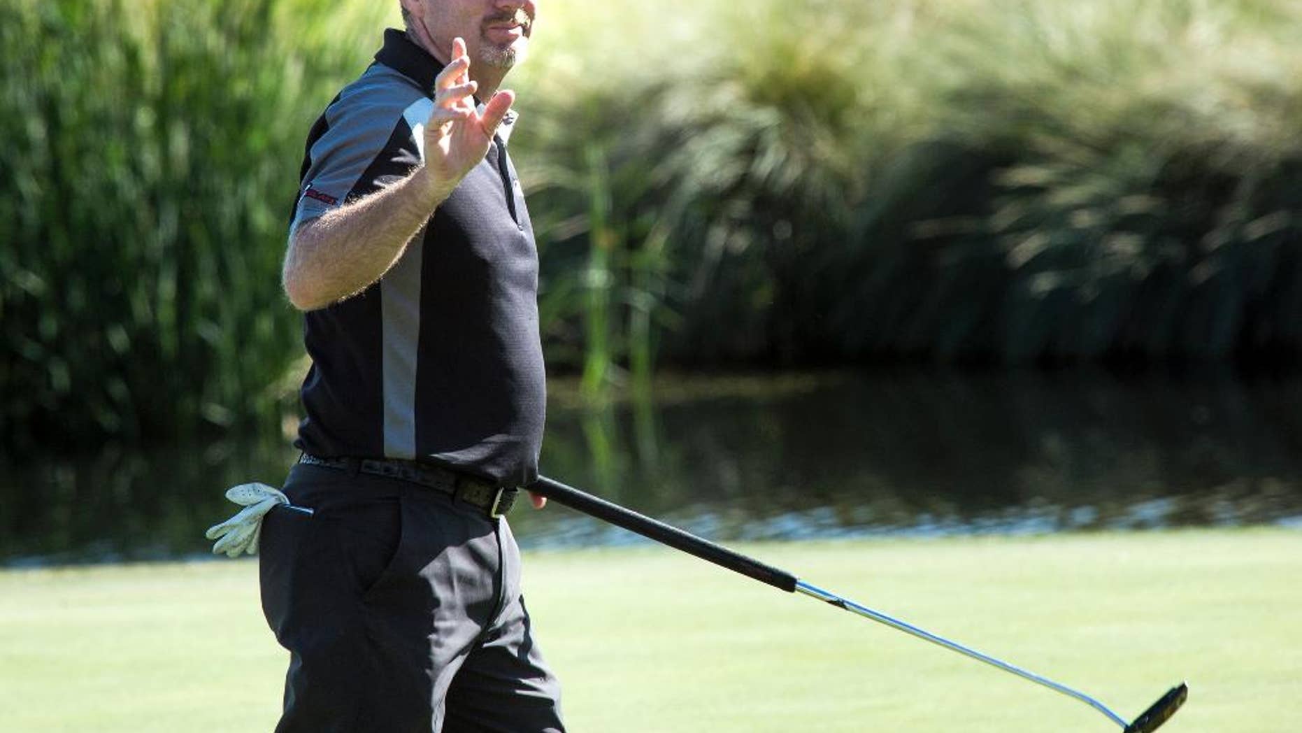 Rod Pampling, from Australia, acknowledges fans after he birdied on the 18th hole on the opening day of the Shriners Hospitals for Children Open golf tournament in Las Vegas, Thursday, Nov. 3, 2016. (Jeff Scheid/Las Vegas Review-Journal via AP)