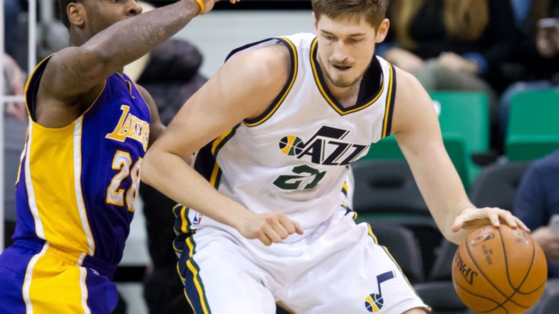 Jan 16, 2016; Salt Lake City, UT, USA; Los Angeles Lakers center Tarik Black (28) defends against Utah Jazz center Tibor Pleiss (21) during the second half at Vivint Smart Home Arena. The Jazz won 109-82. Mandatory Credit: Russ Isabella-USA TODAY Sports
