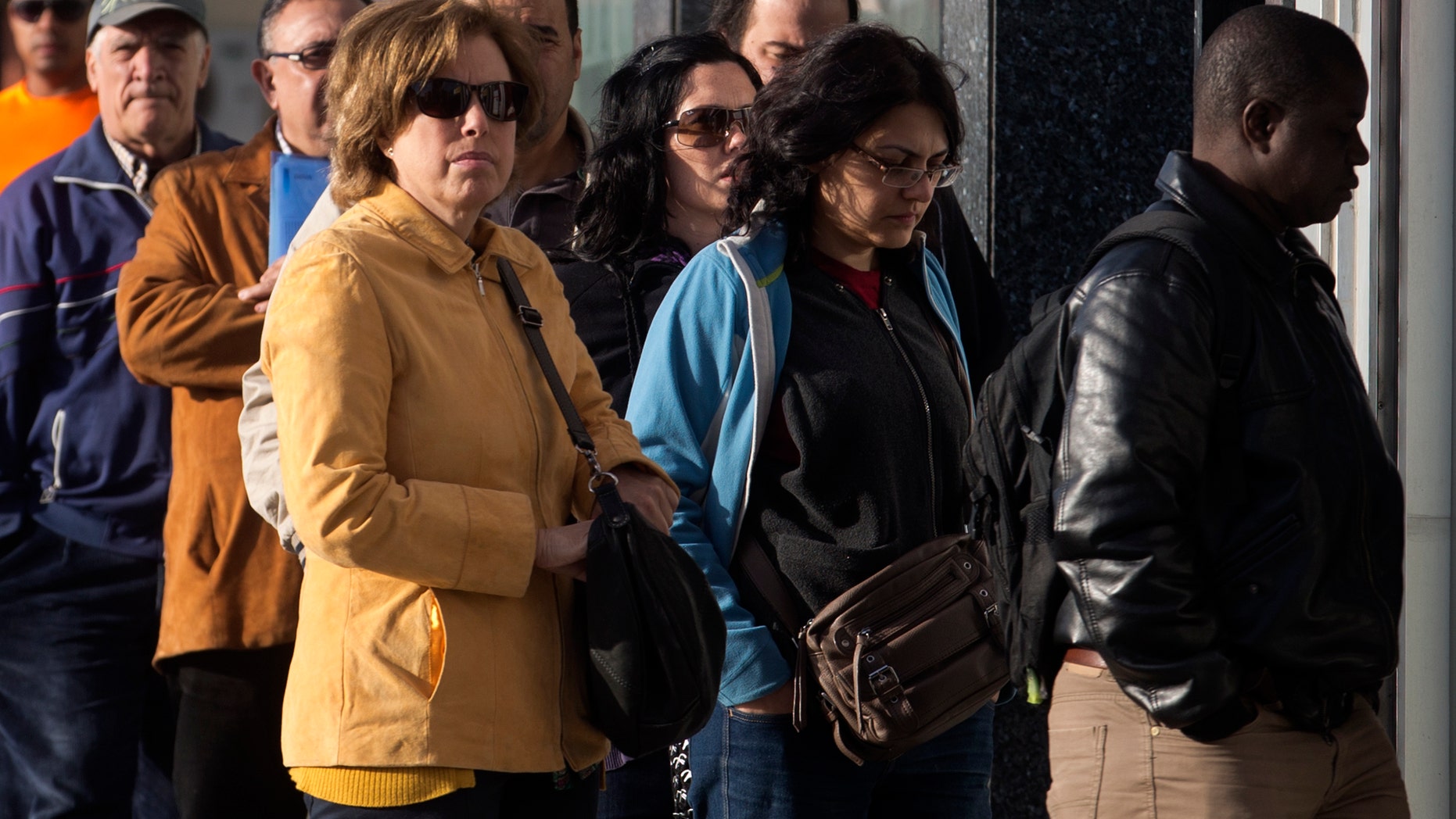 April 25, 2013: People enter an office to register for job placement in Madrid, Spain. Spain’s National Statistics Institute said the country’s unemployment rate shot up to a record 27.2 percent in the first quarter of 2013 taking the total to 6.2 million. Spain is in recession again as it struggles to deal with the collapse of its once-booming real estate sector in 2008.