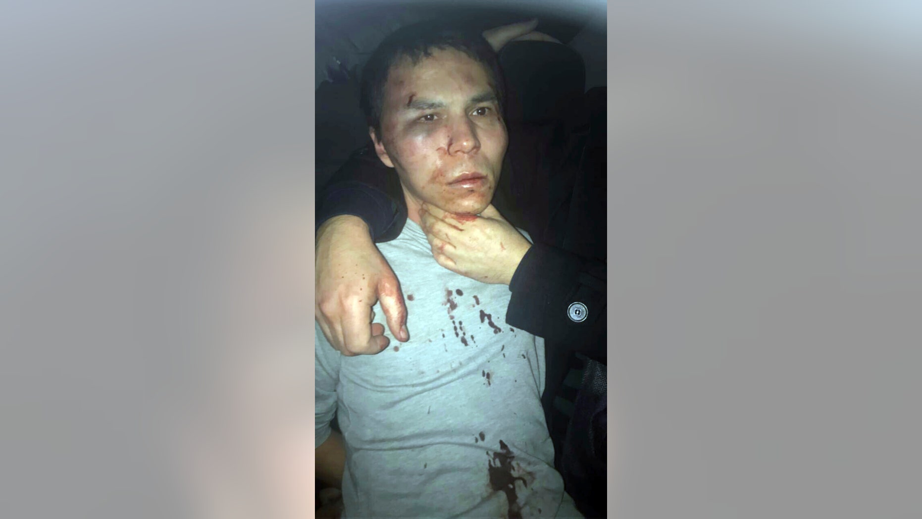 In this file photo, a man believed to be the gunman who killed dozens at an Istanbul nightclub films himself as he wanders nearby to Istanbul's Taksim square