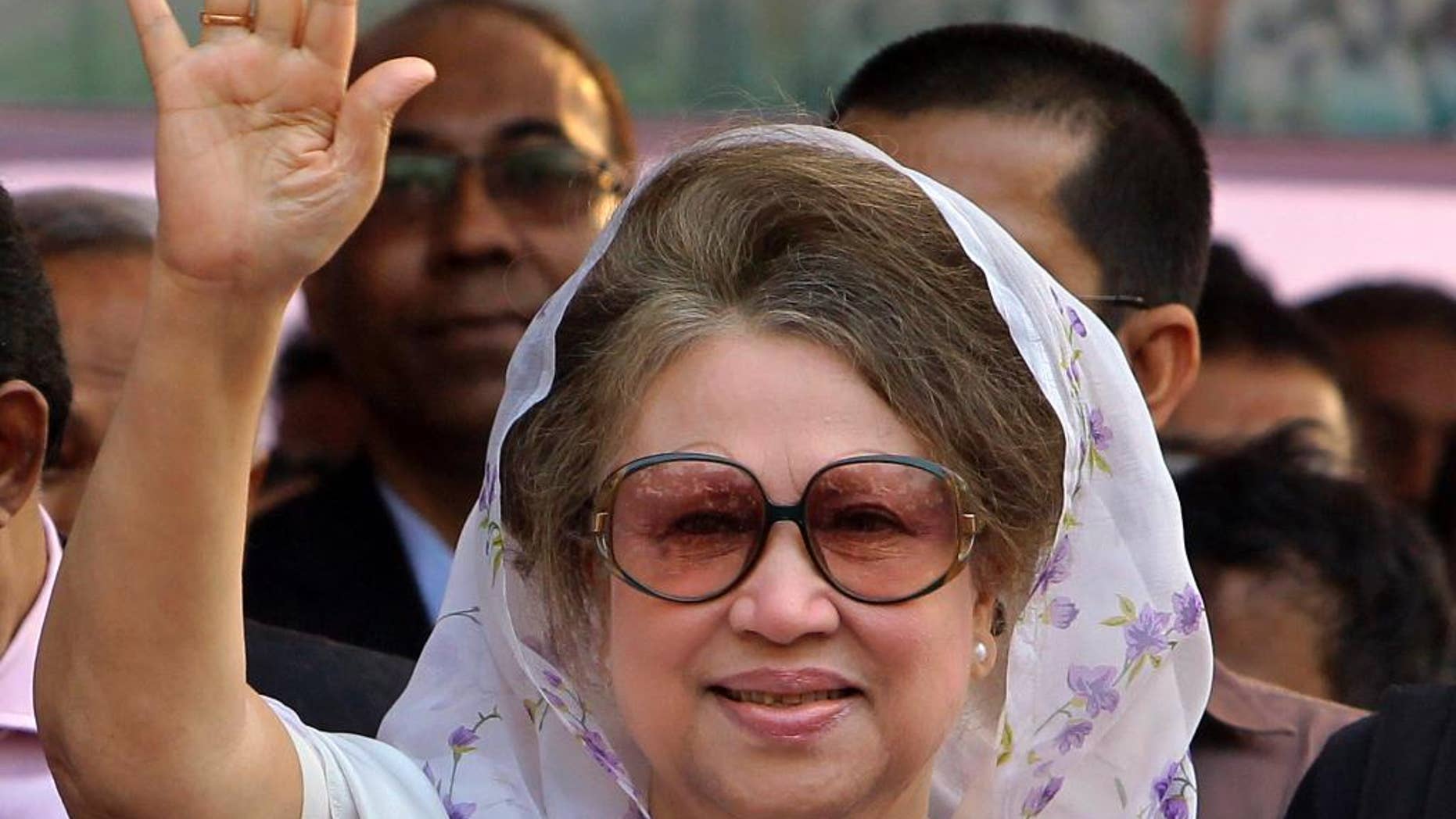 FILE - In this Jan. 20, 2014 file photo, Bangladesh's former Prime Minister and opposition Bangladesh Nationalist Party (BNP) leader Khaleda Zia, waves as she arrives for a public meeting in Dhaka, Bangladesh. A Bangladesh court issued an arrest warrant Wednesday for the ex-Prime Minister in two graft cases after she failed to appear in court for the fourth time. (AP Photo/A.M. Ahad, File)